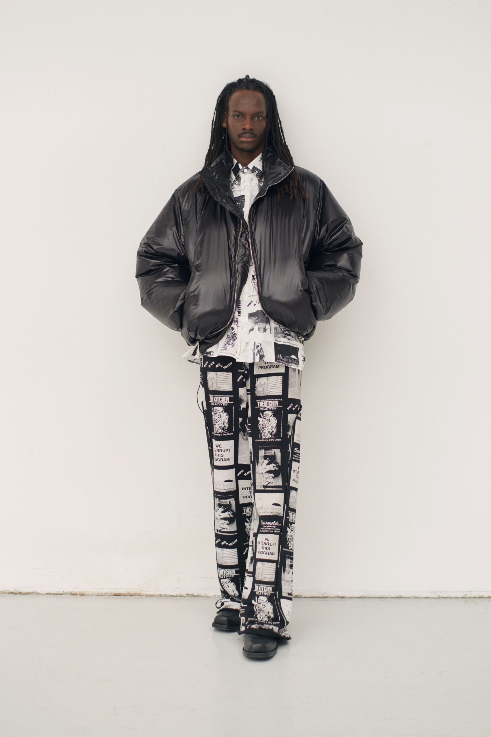 black oversized jacket with printed shirt and pants