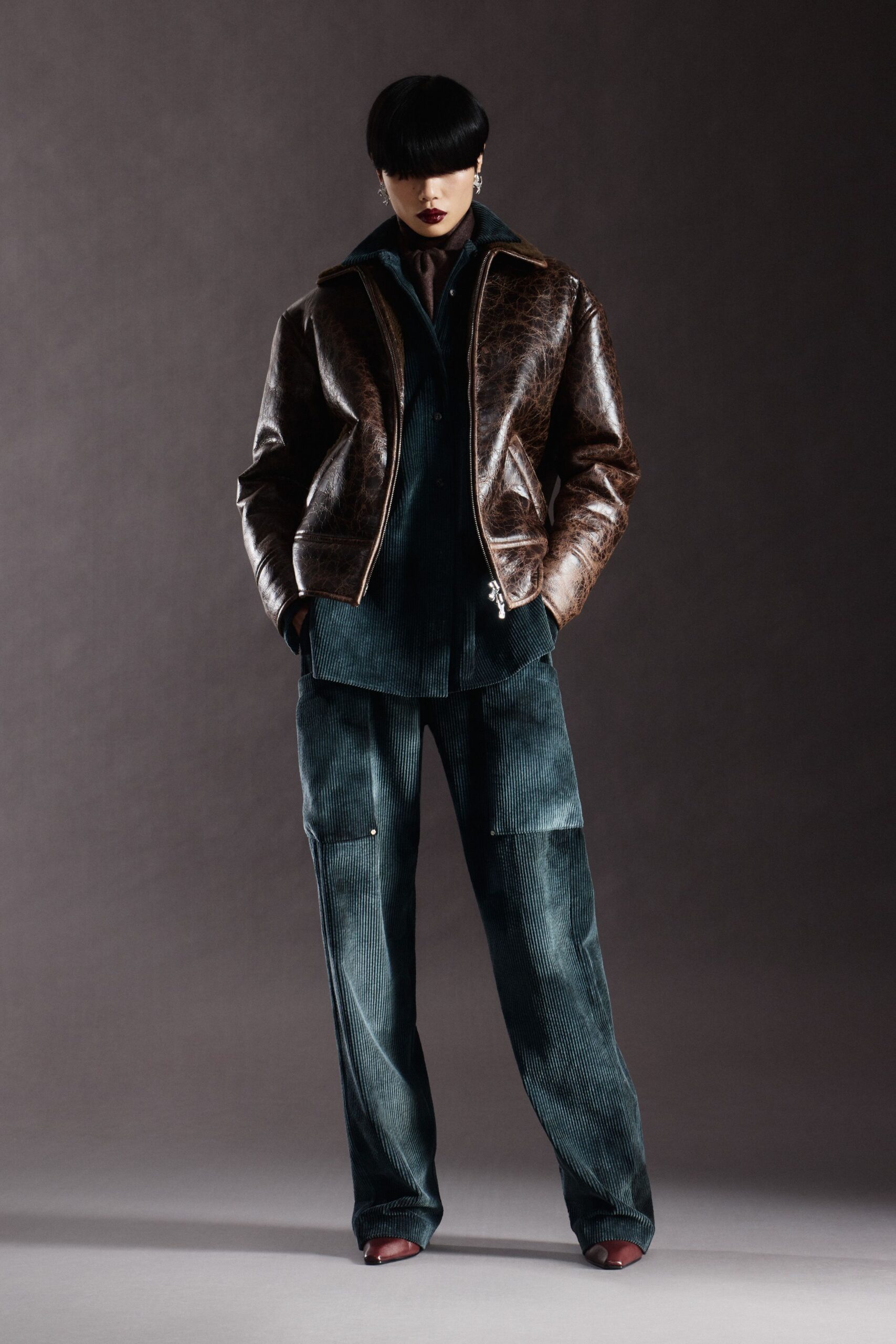 brown leather jacket with blue shirt and cargo pants