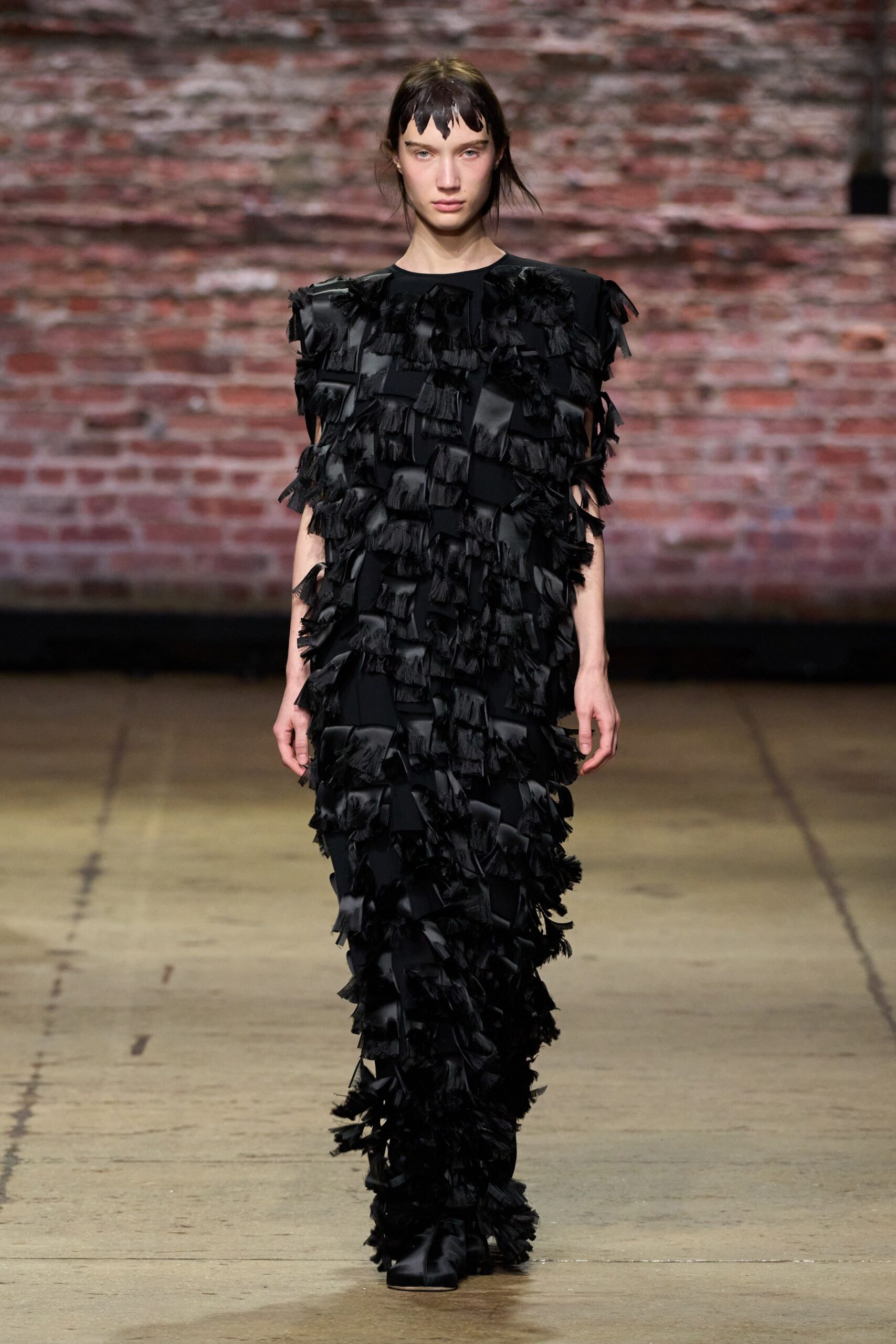 black fringed sleeveless dress