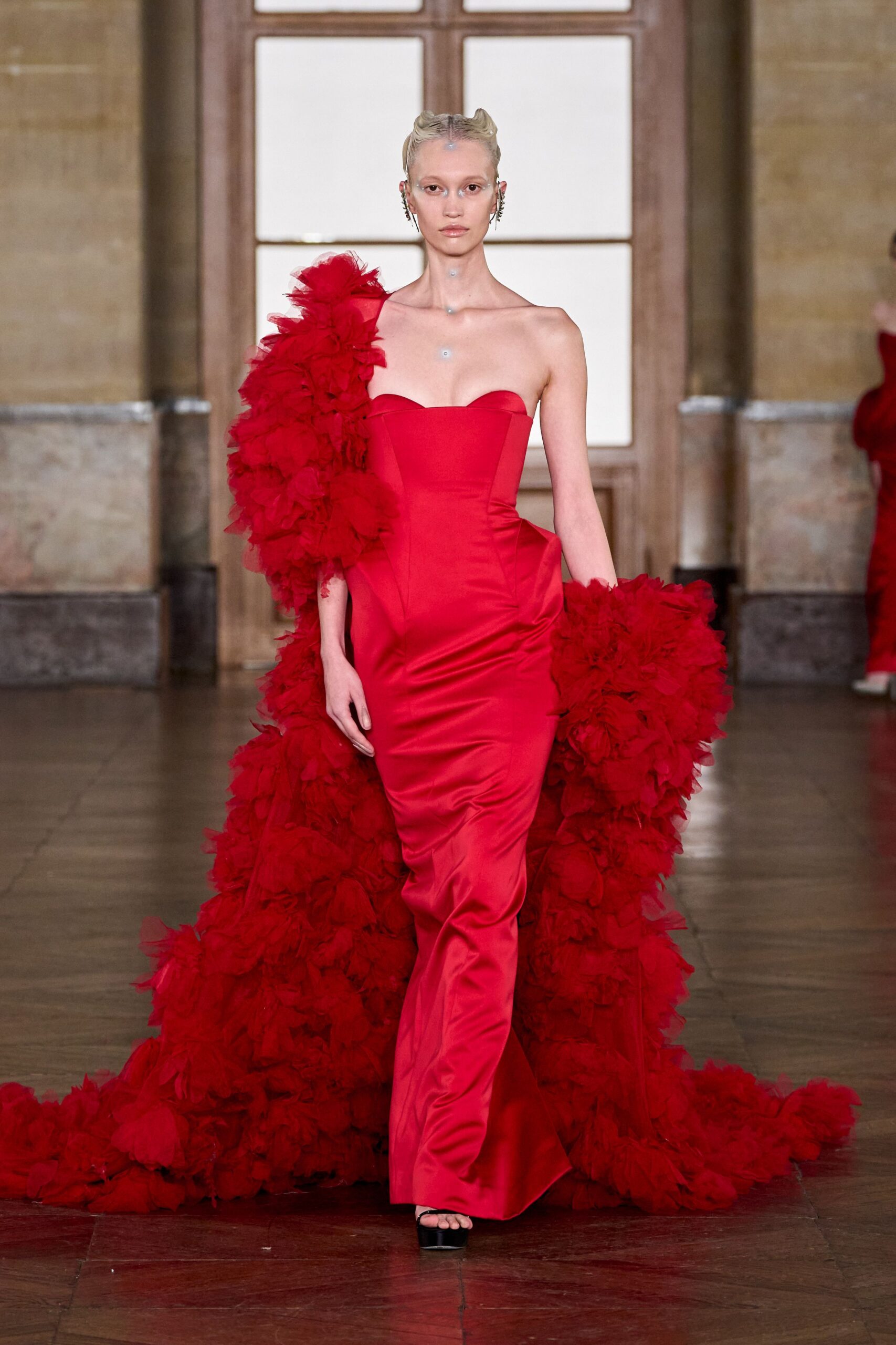 red silk strapless fitted ruffled maxi gown