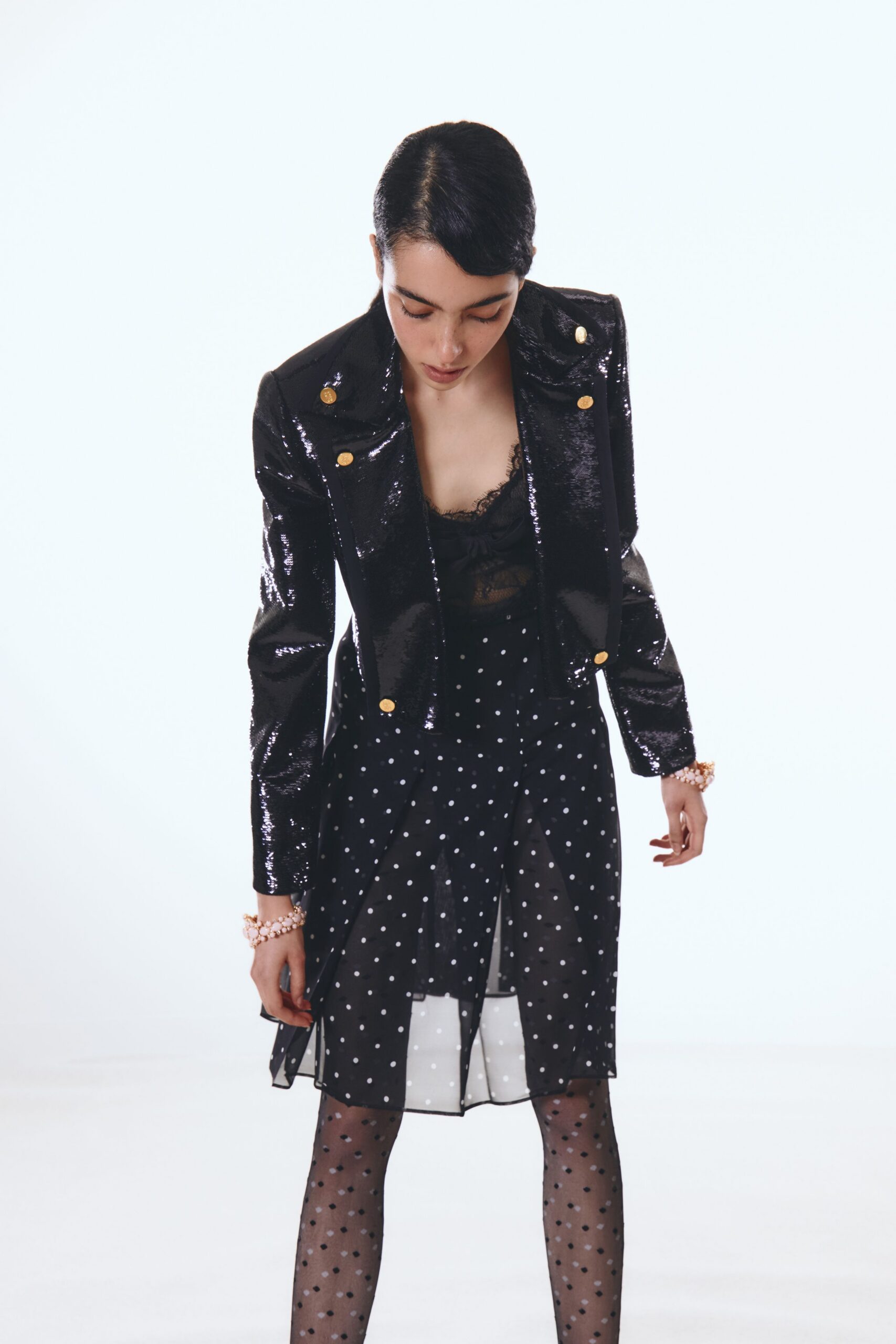 black sequin jacket and polka-dot dress