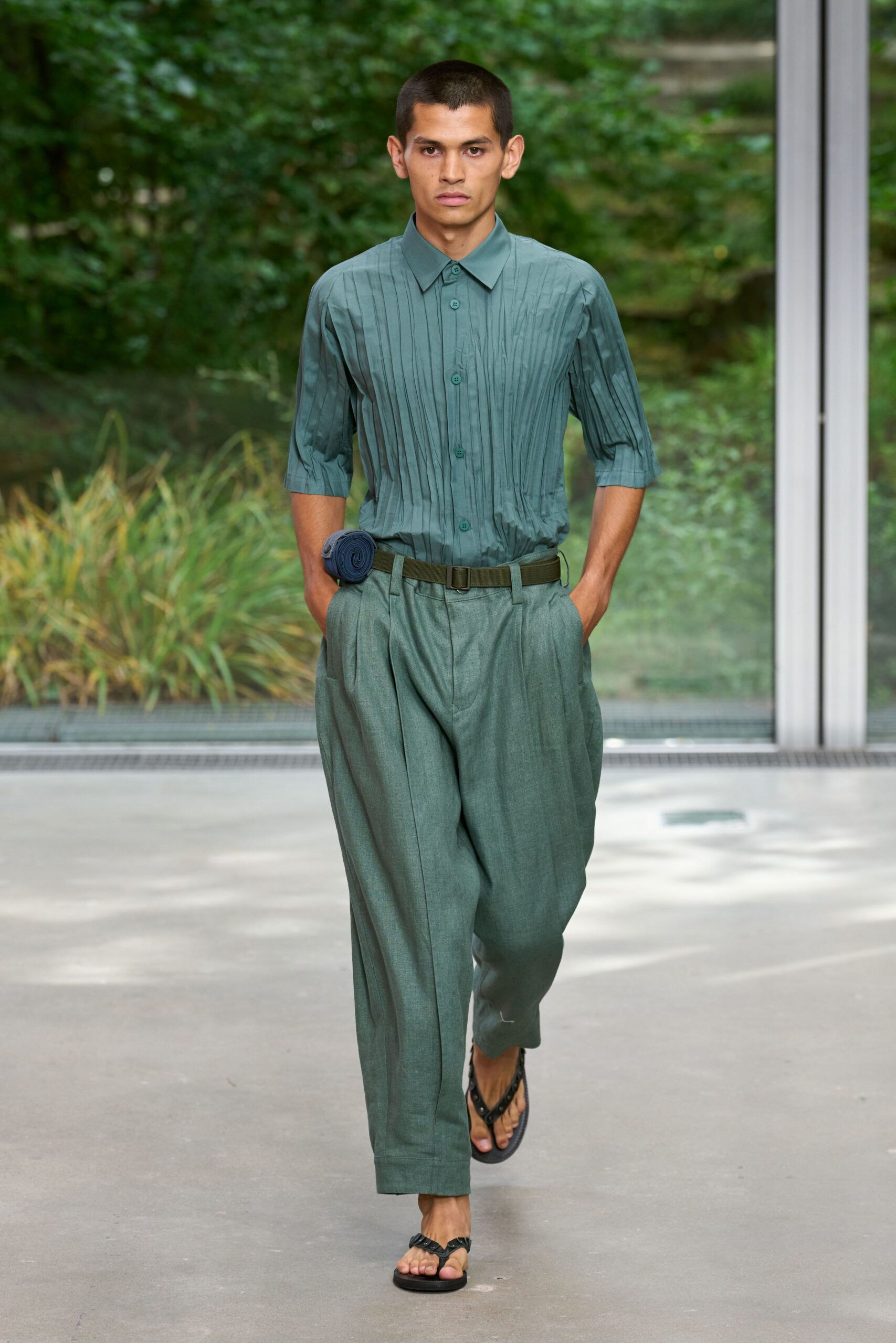 green pleated shirt with wide-leg pants