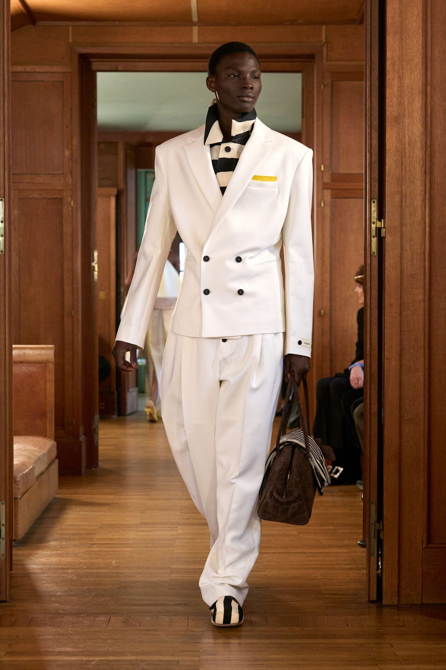 white tailored suit with striped shoes
