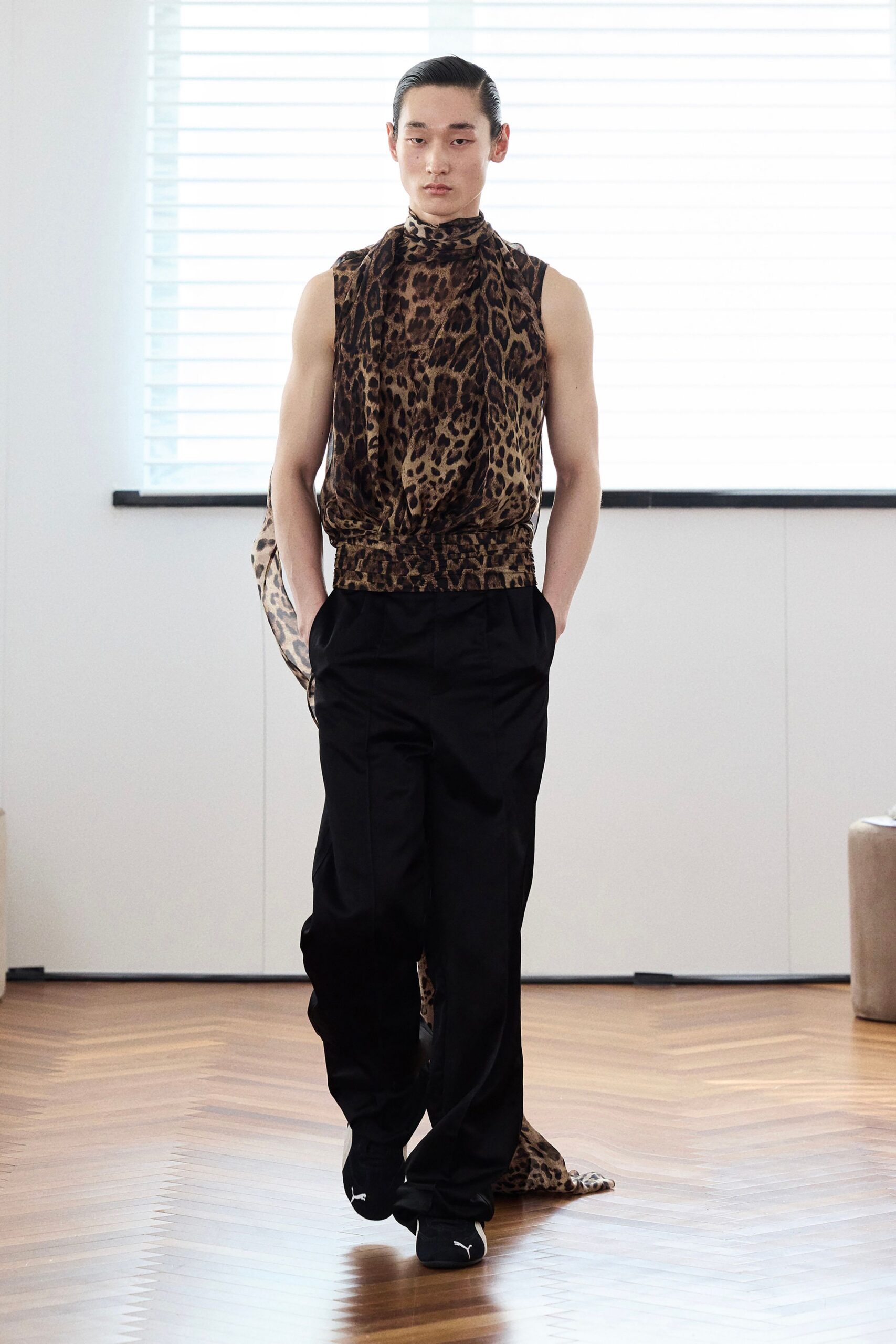 brown animal-print sleeveless top with black pants