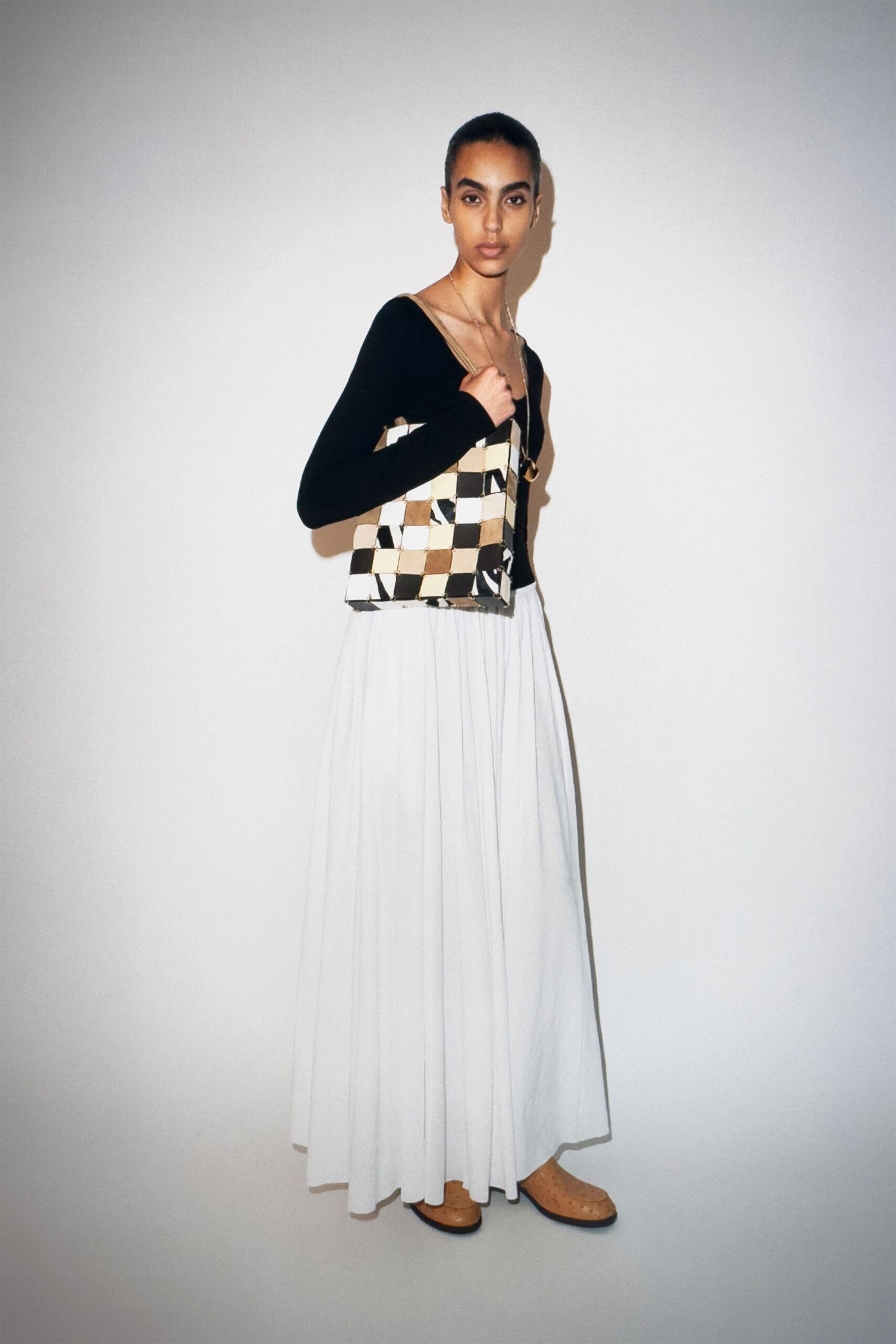 black top white pleated skirt