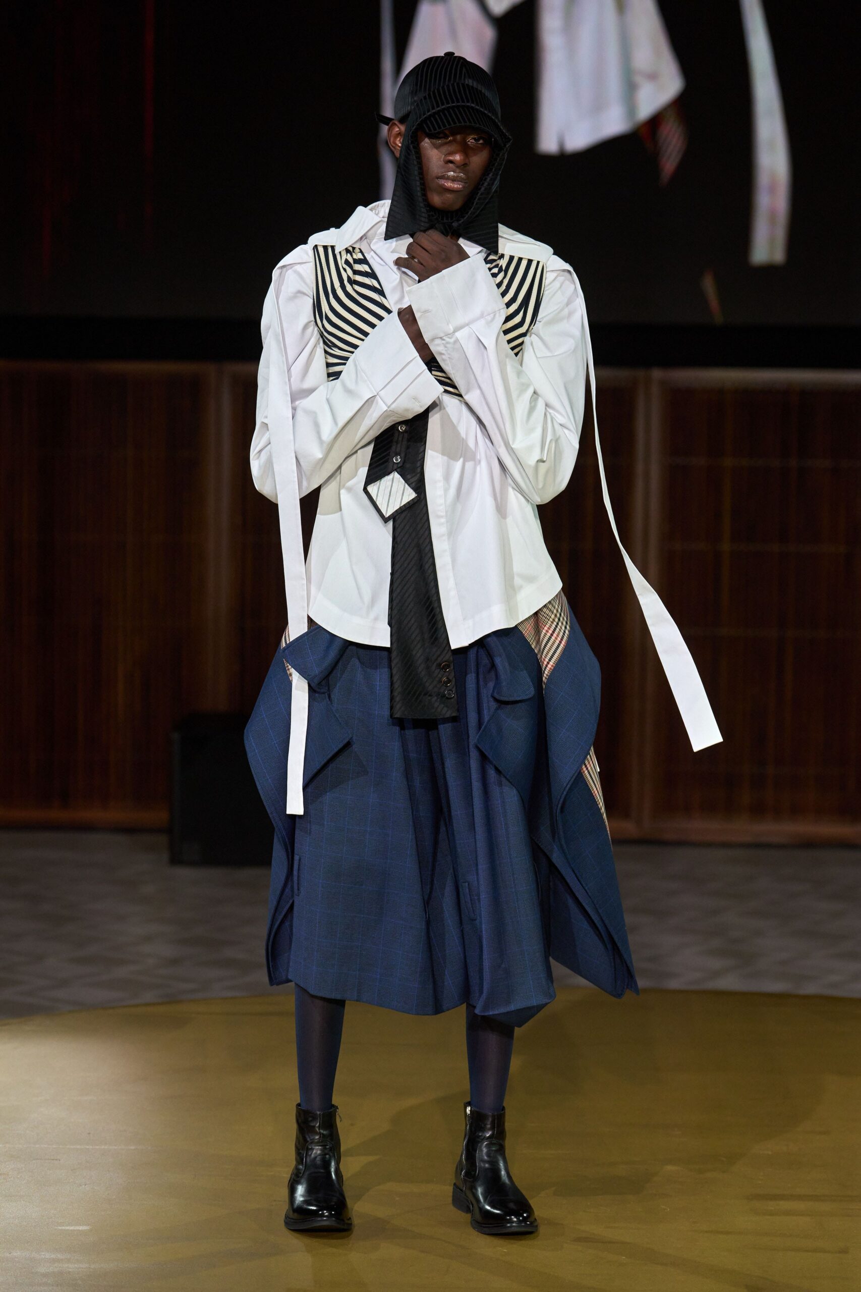 white shirt blue asymmetric skirt