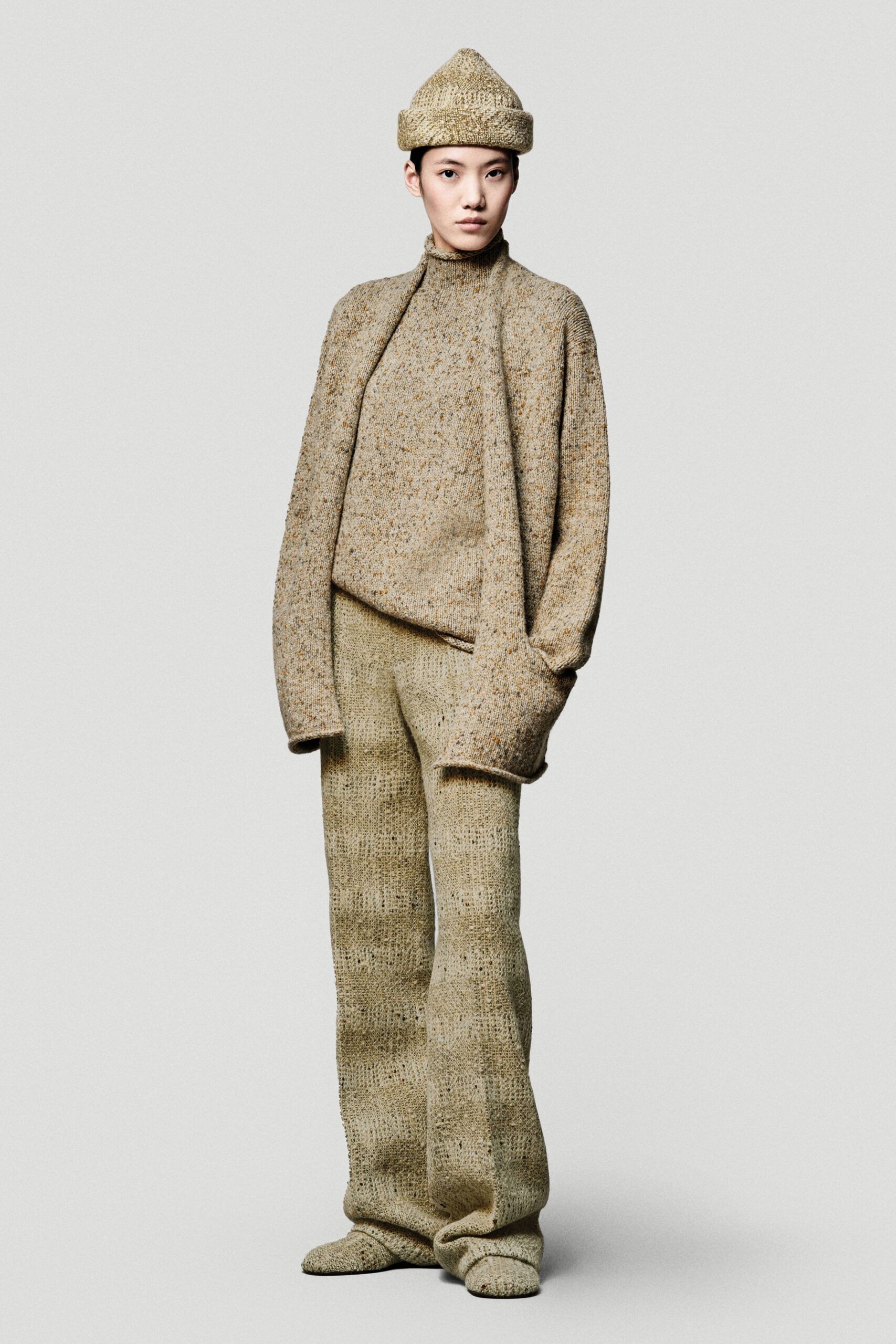 beige wool long-sleeve turtleneck relaxed ribbed sweater