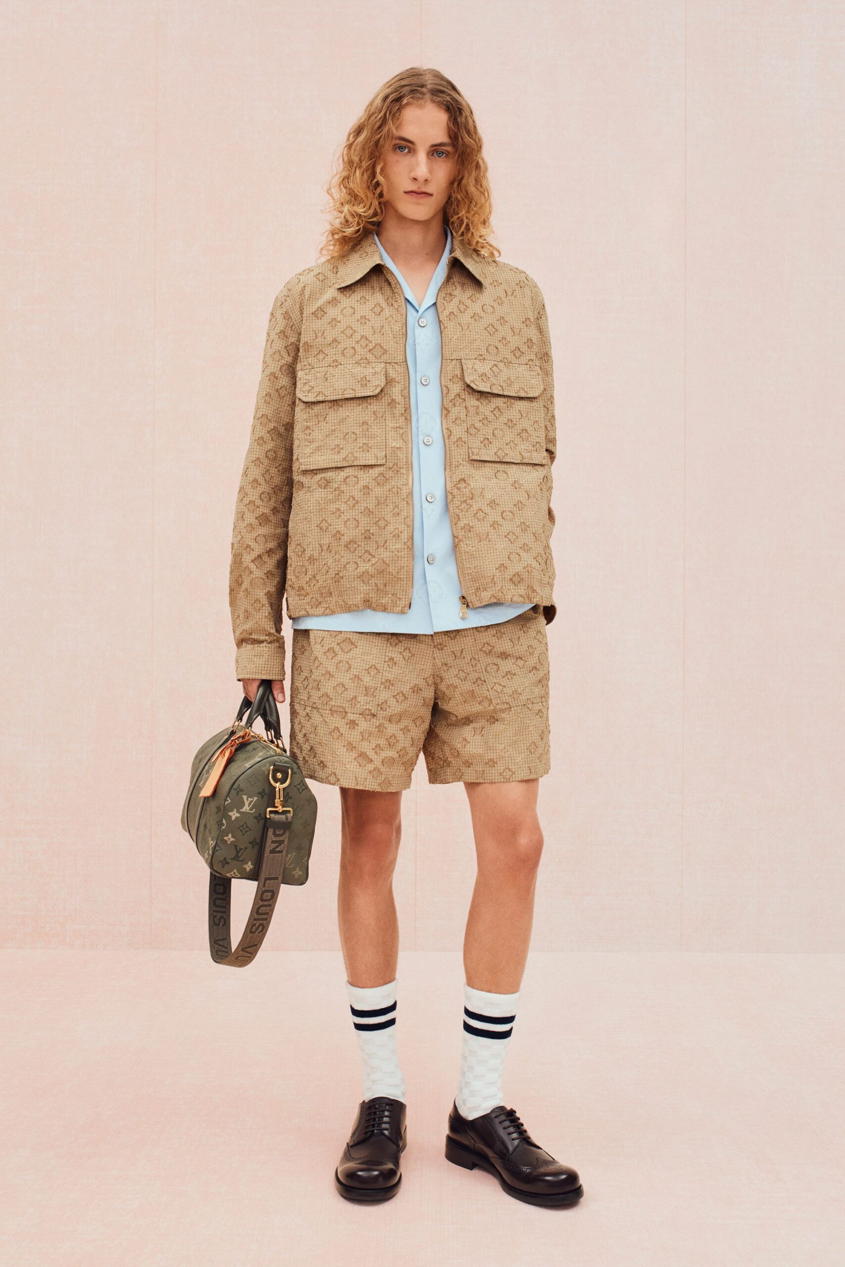 beige jacket light blue shirt shorts