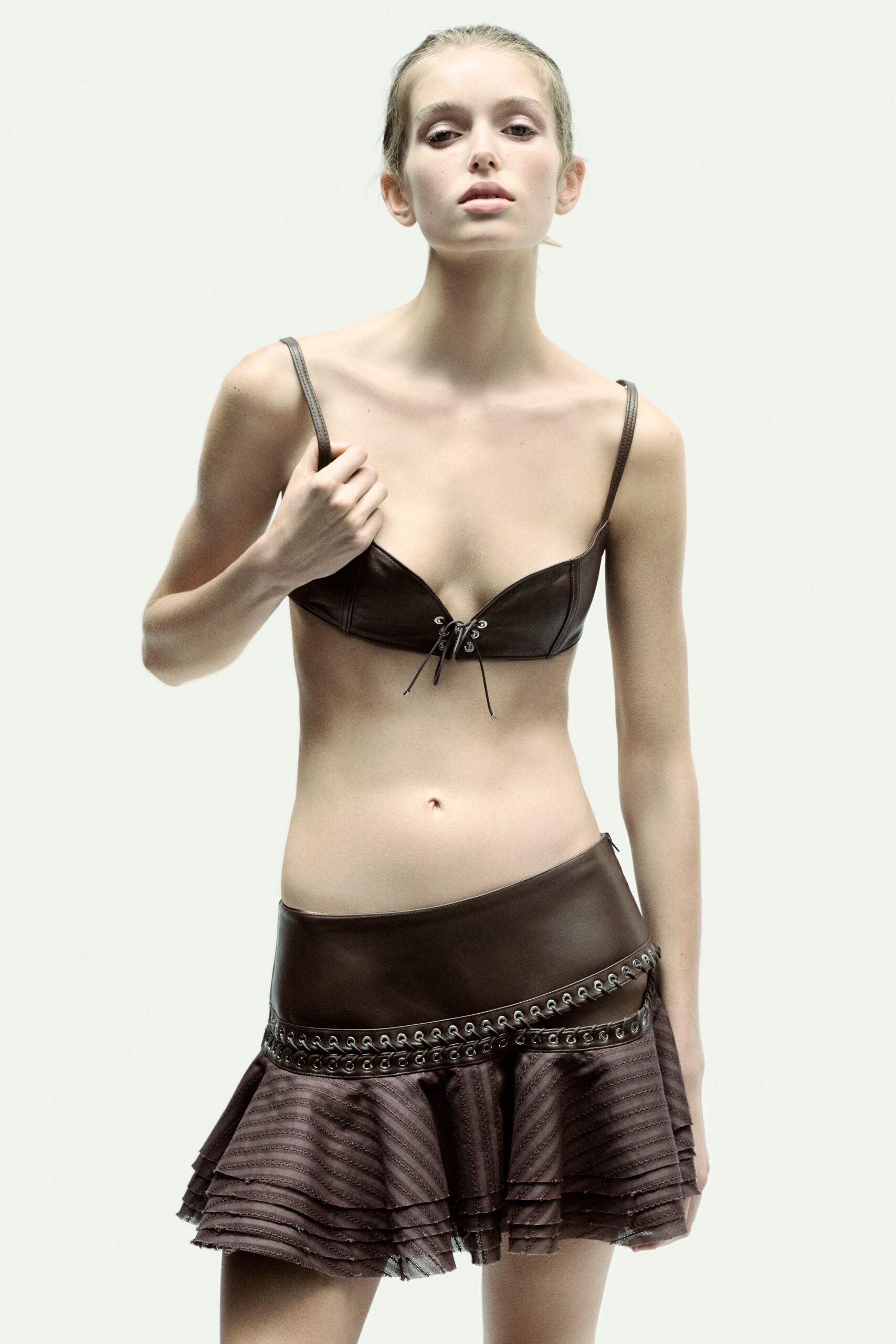 brown leather sleeveless fitted ruffled top