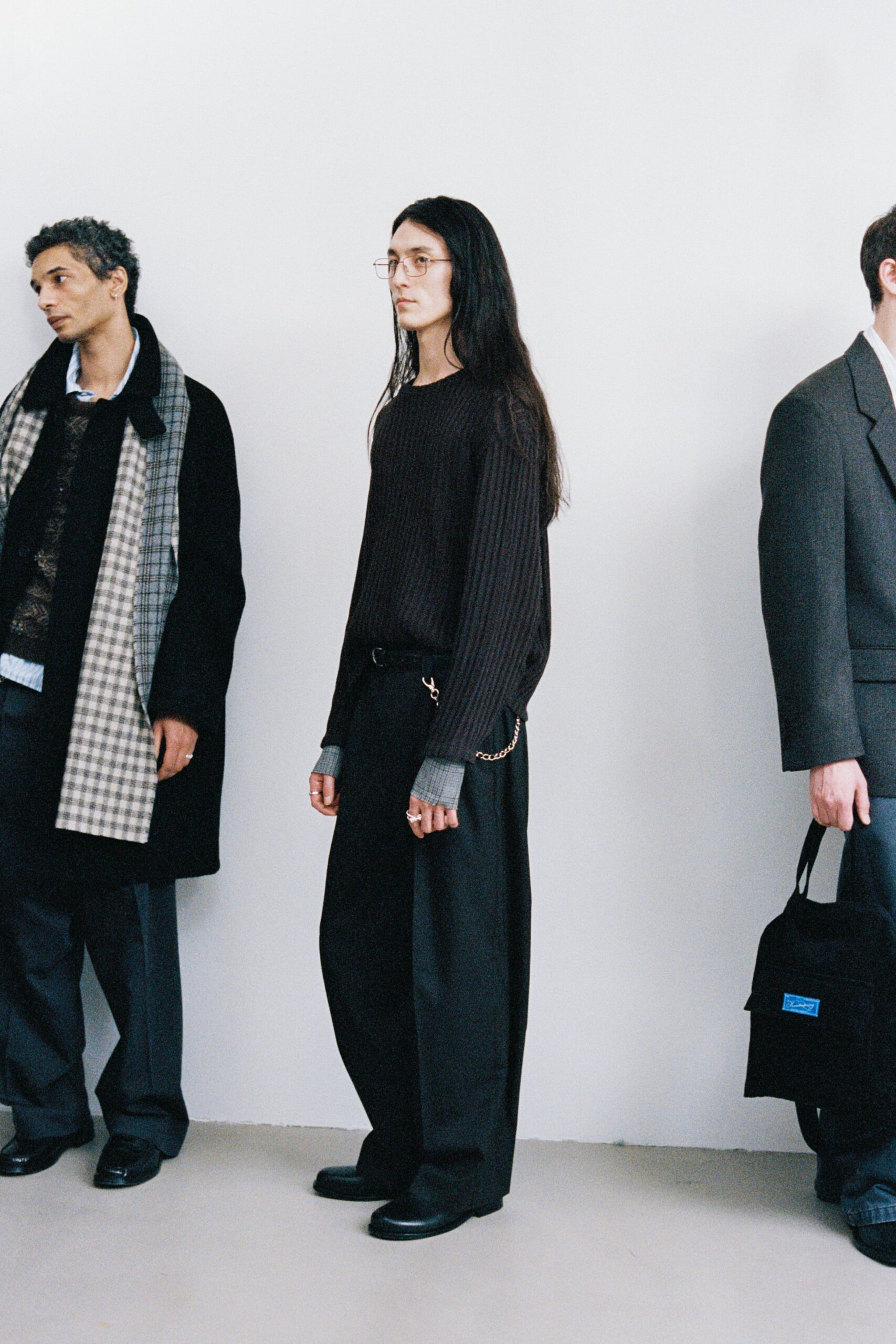black wool coat and brown sweater