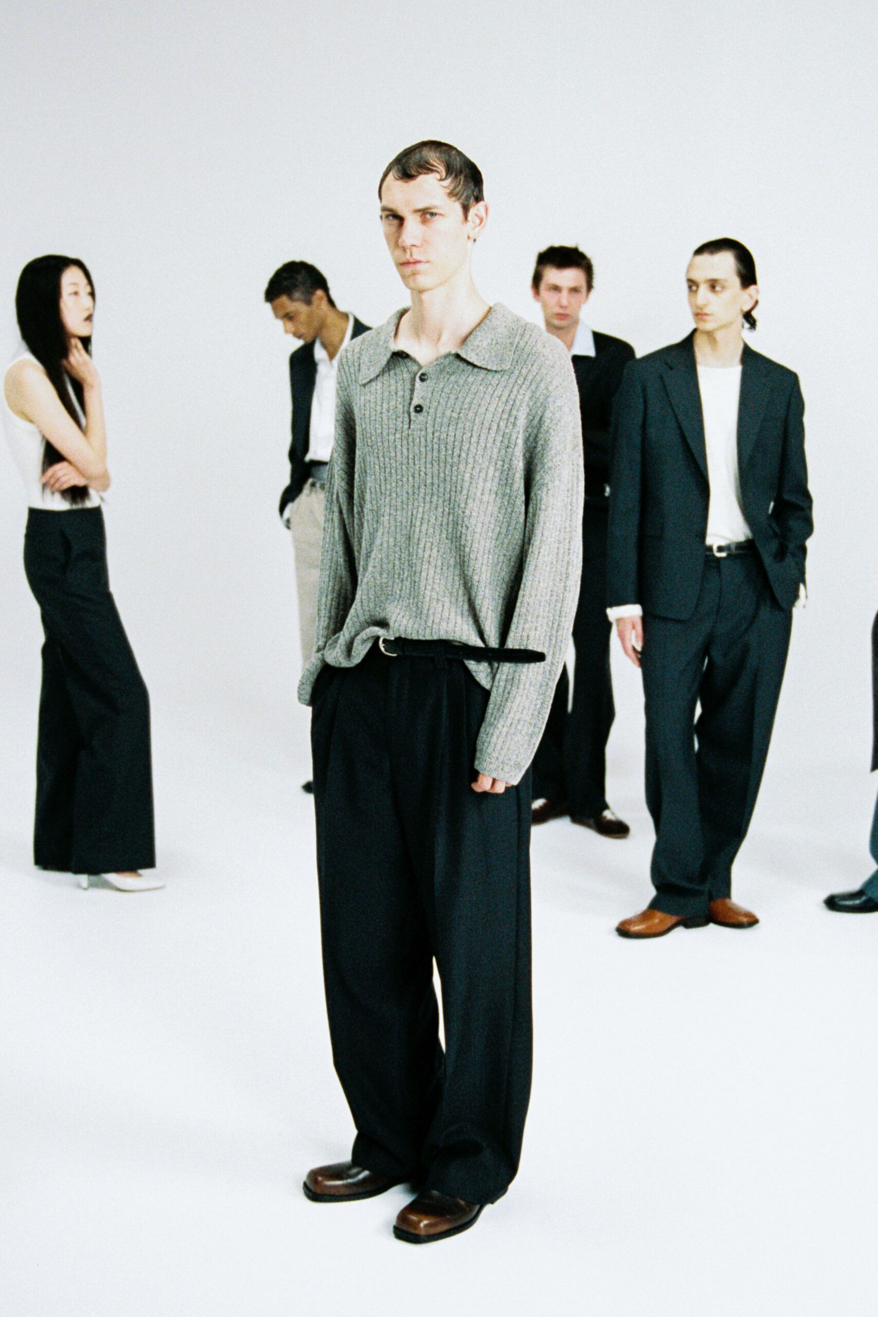 gray sweater and black pants