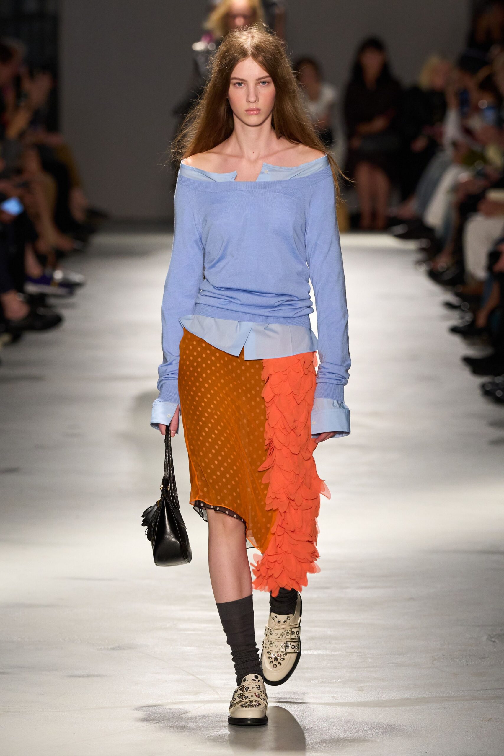 blue relaxed top with orange ruffled skirt
