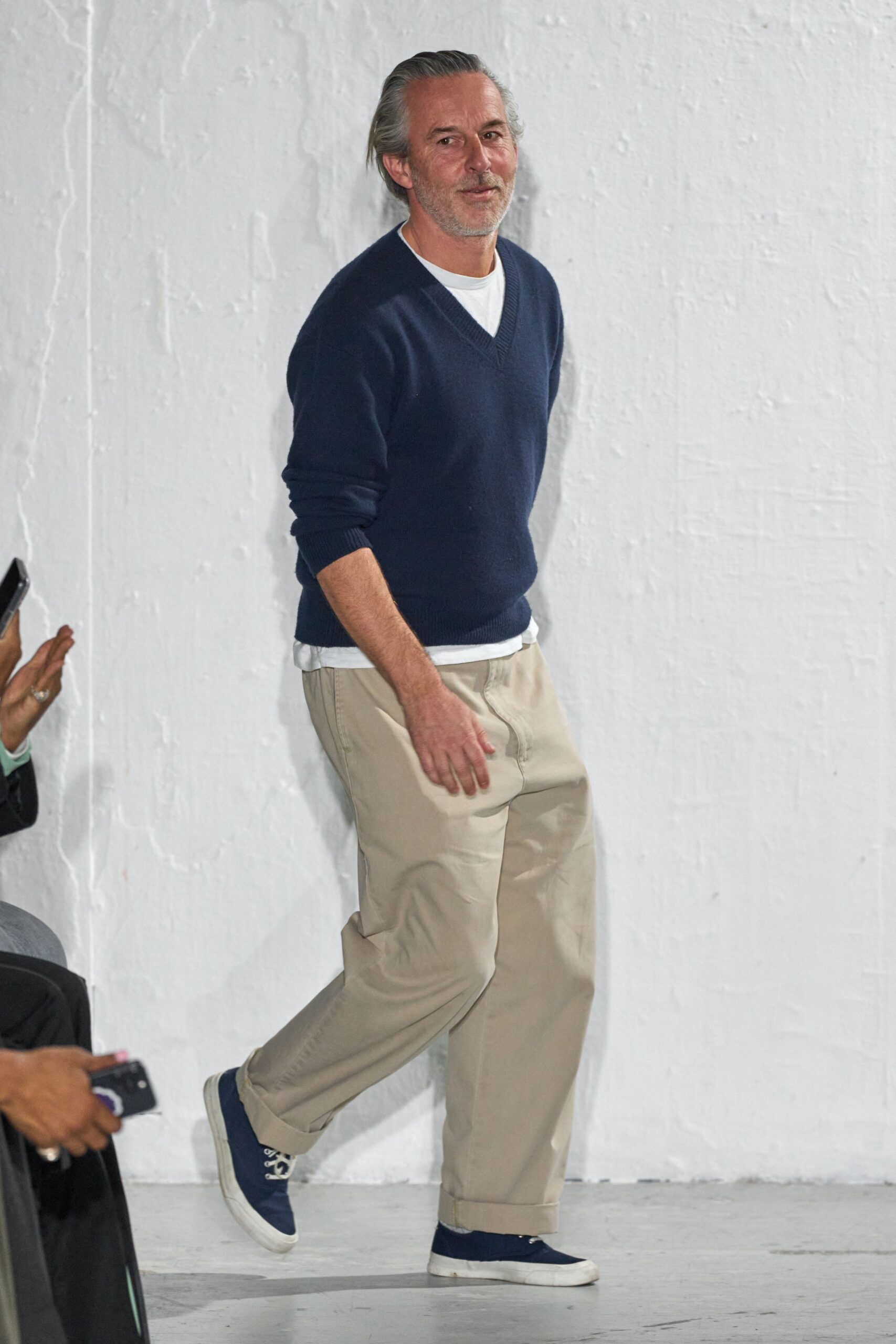 navy sweater white shirt beige pants