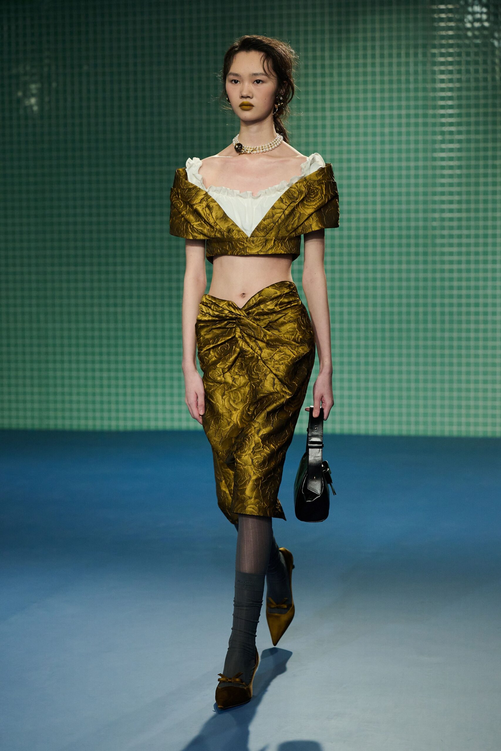 gold silk off-shoulder top and skirt