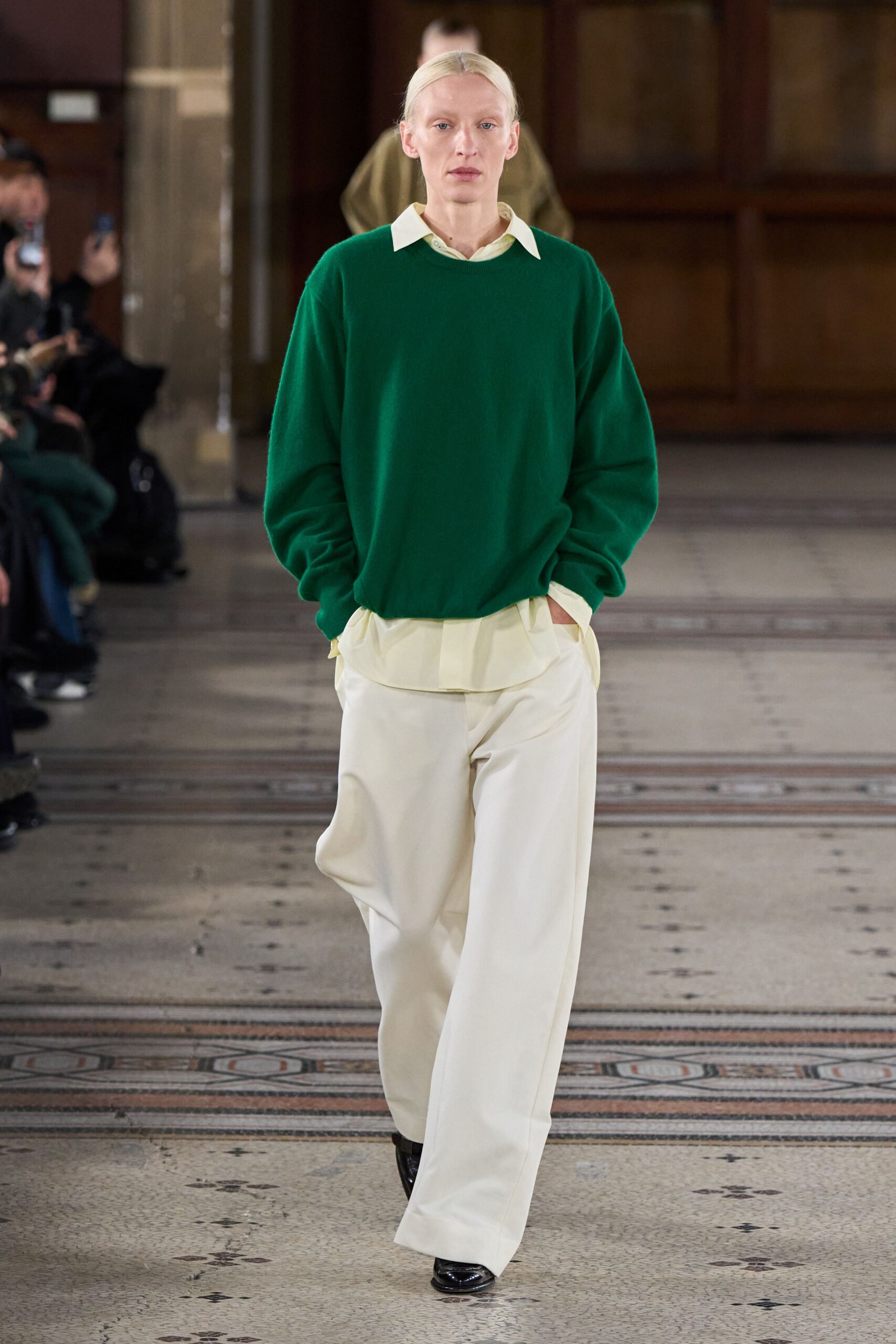 green oversized sweater with beige pants