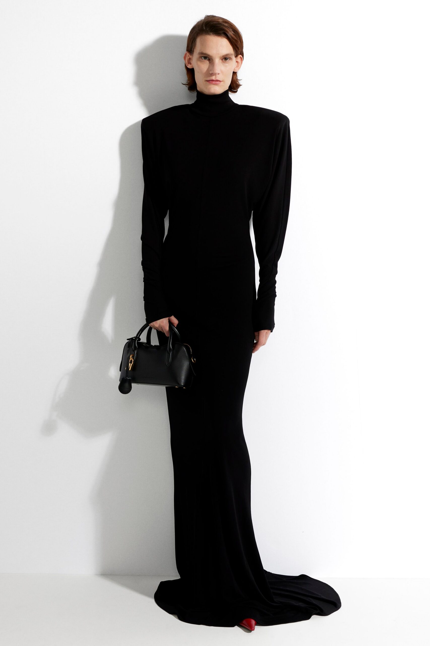 black fitted gown with red heels