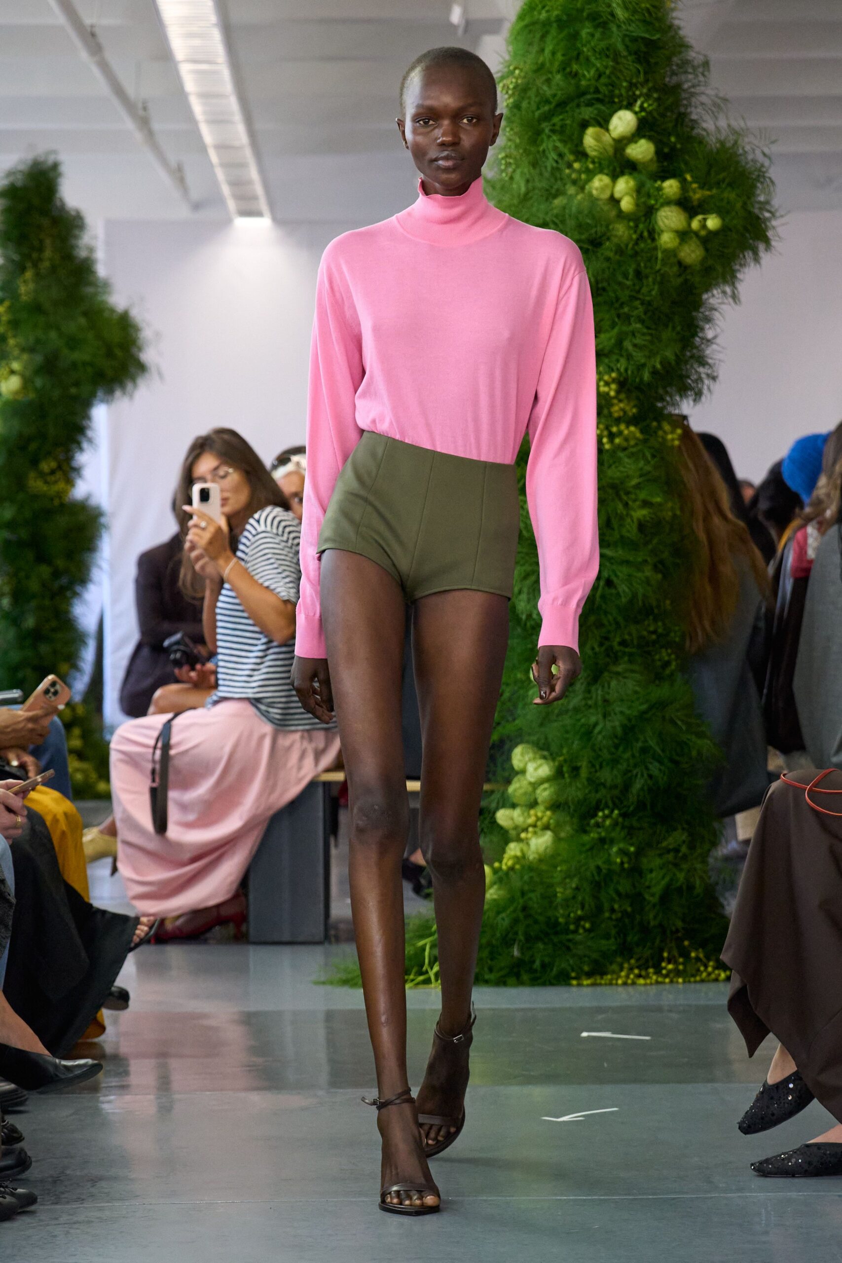 pink fitted top green shorts