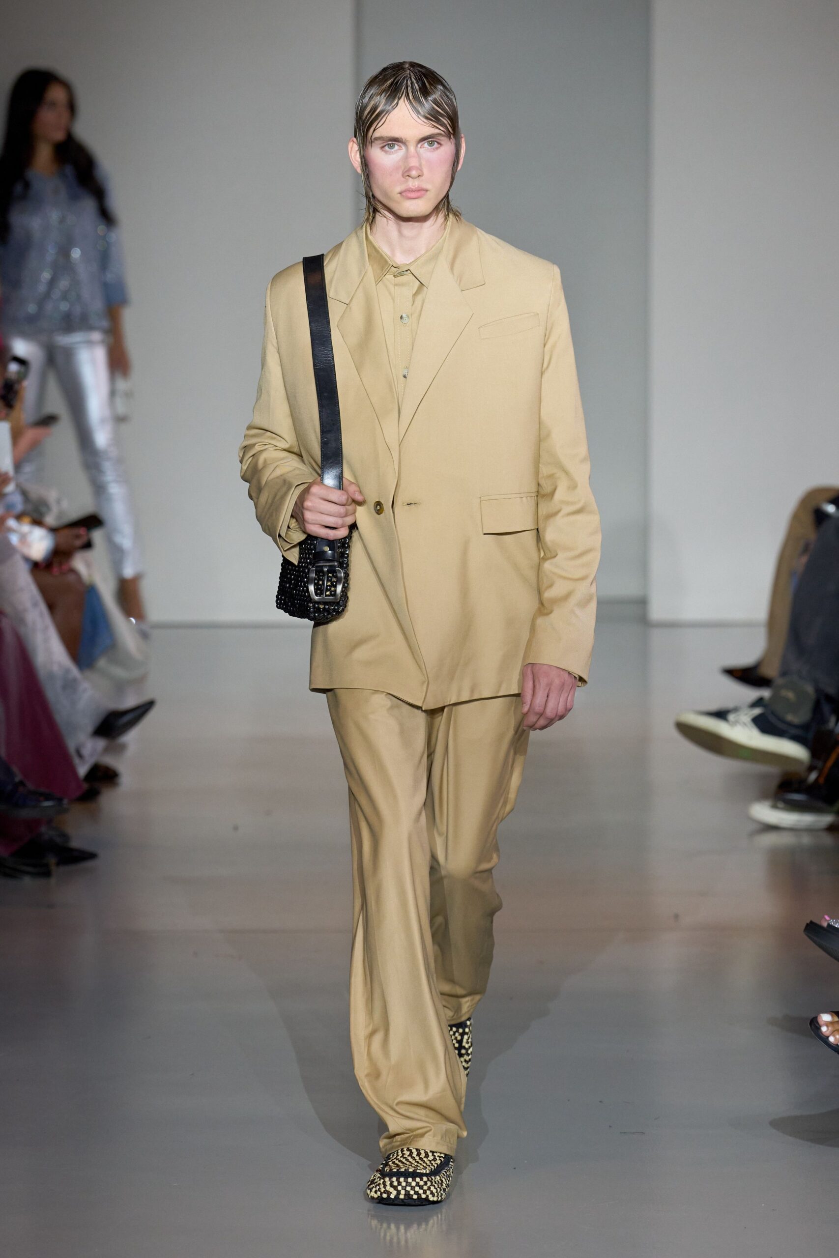 beige tailored suit with green shirt