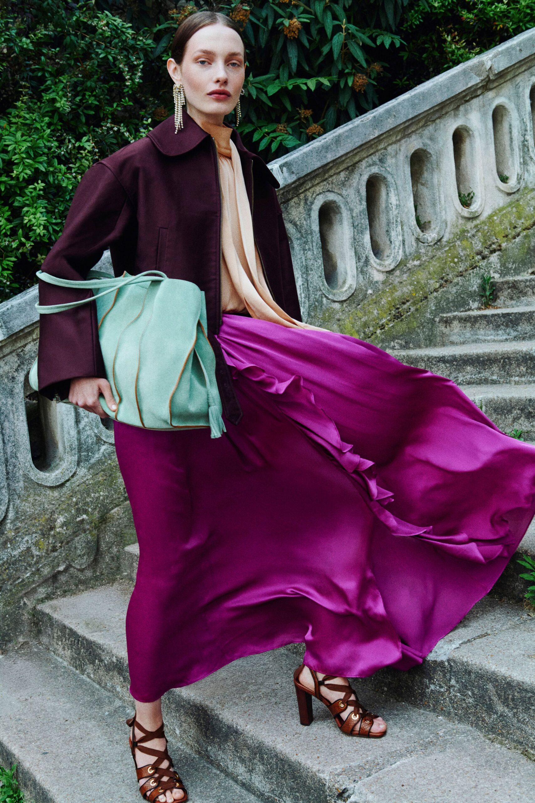 brown structured jacket with purple skirt
