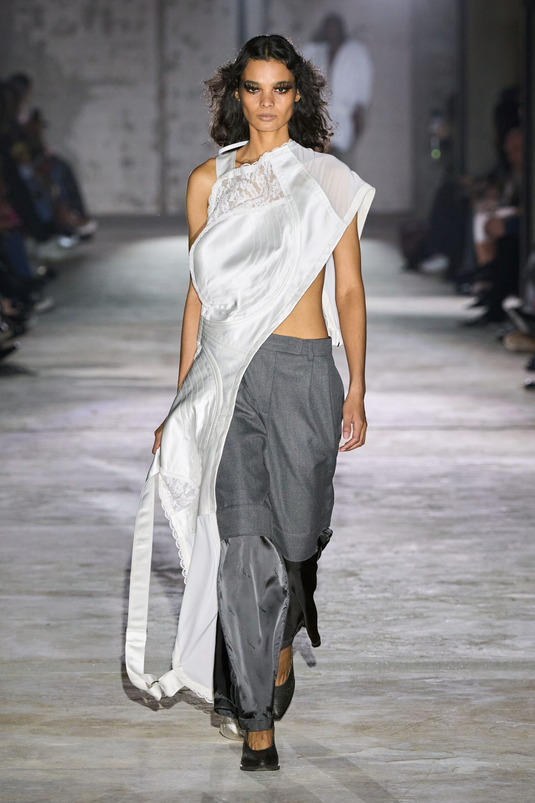 white silk draped dress with gray pants