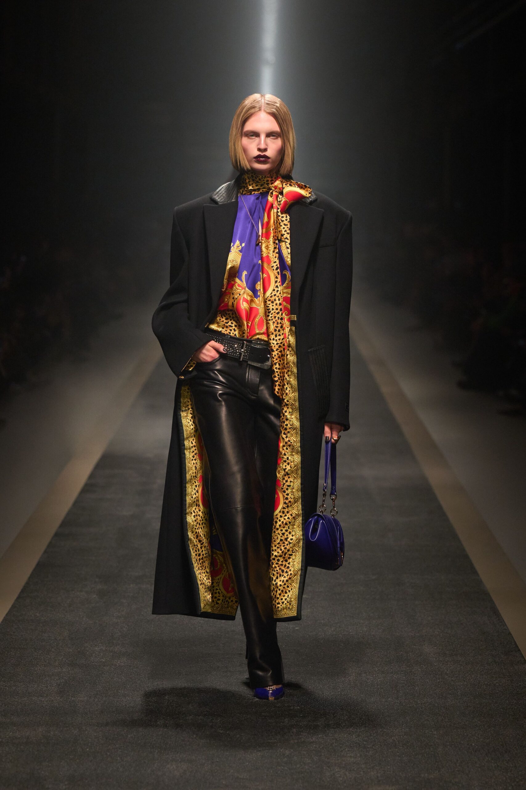 black coat multi-colored top leather pants