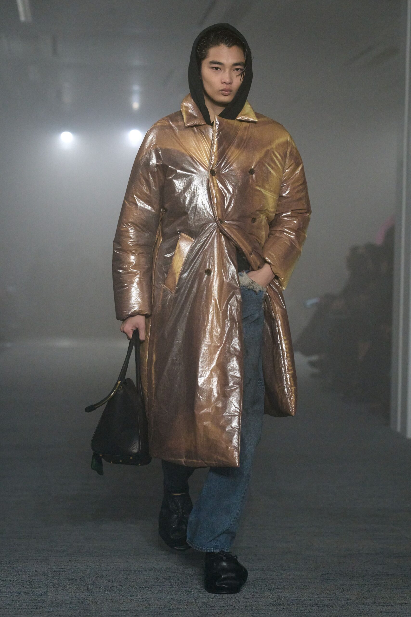 gold vinyl coat with denim pants
