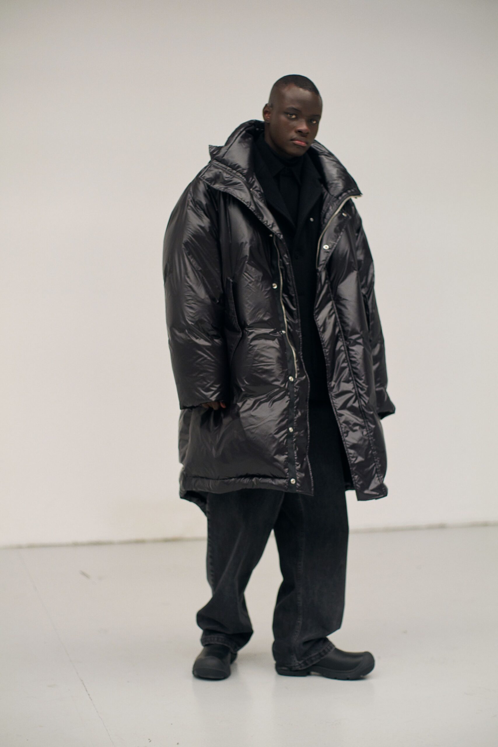 oversized black vinyl coat