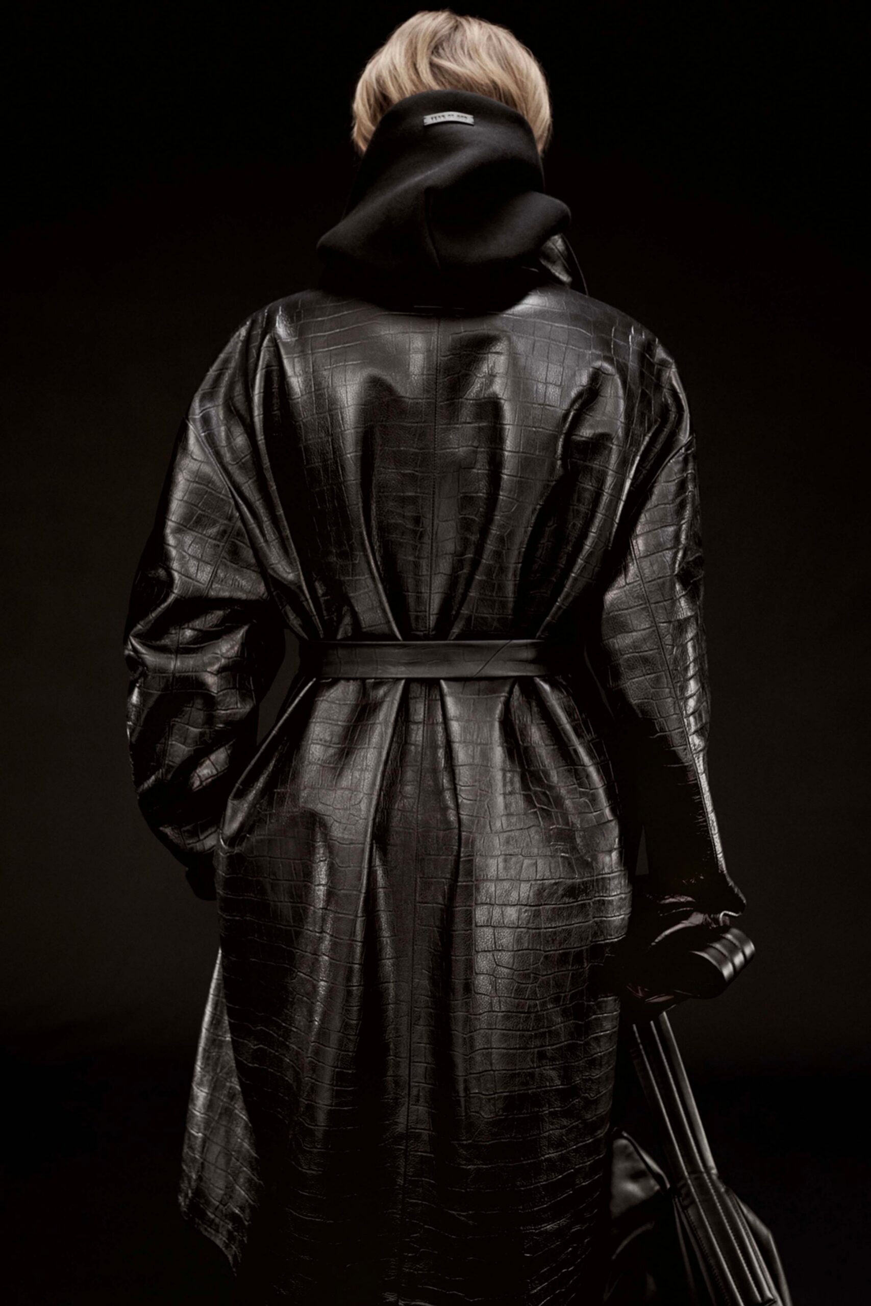 black leather long-sleeve collared relaxed zippered belted coat