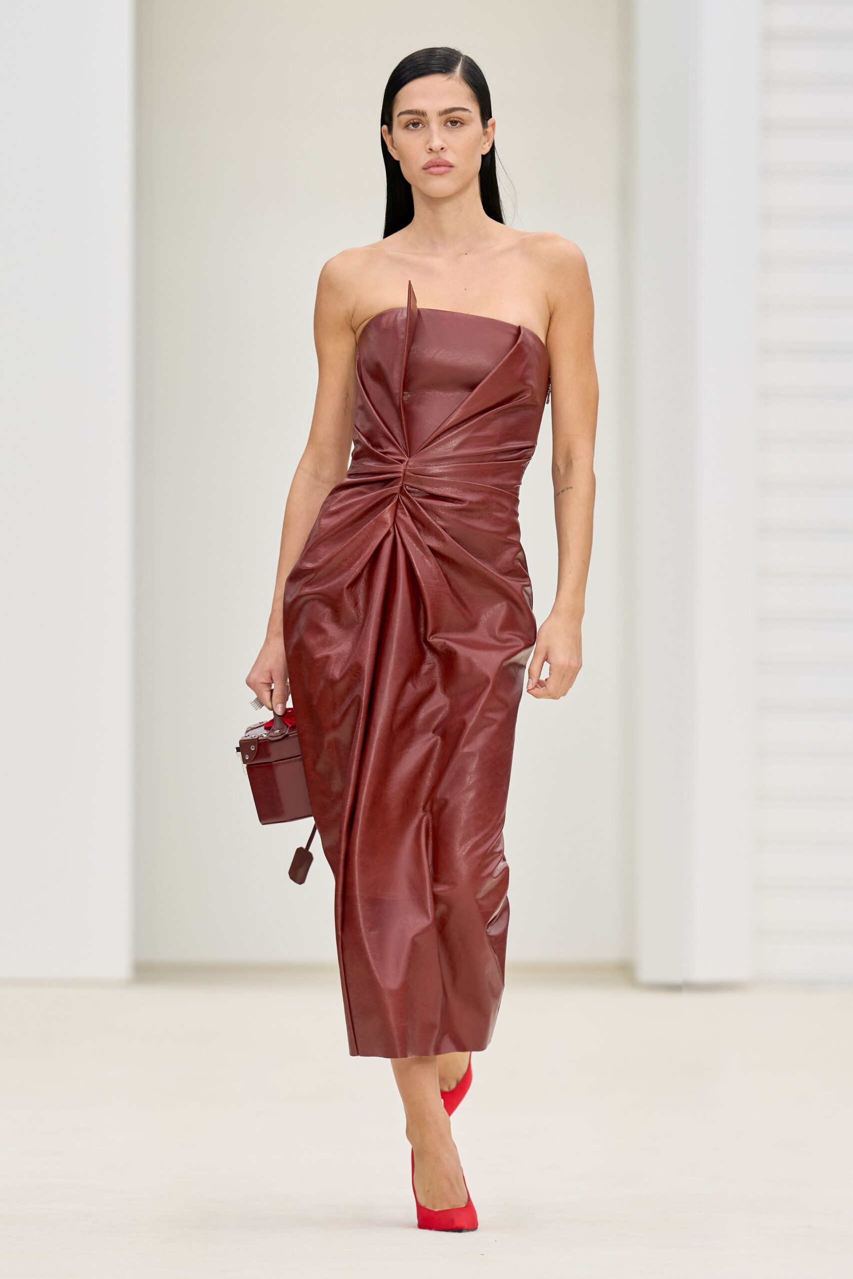red leather strapless fitted ruched midi dress