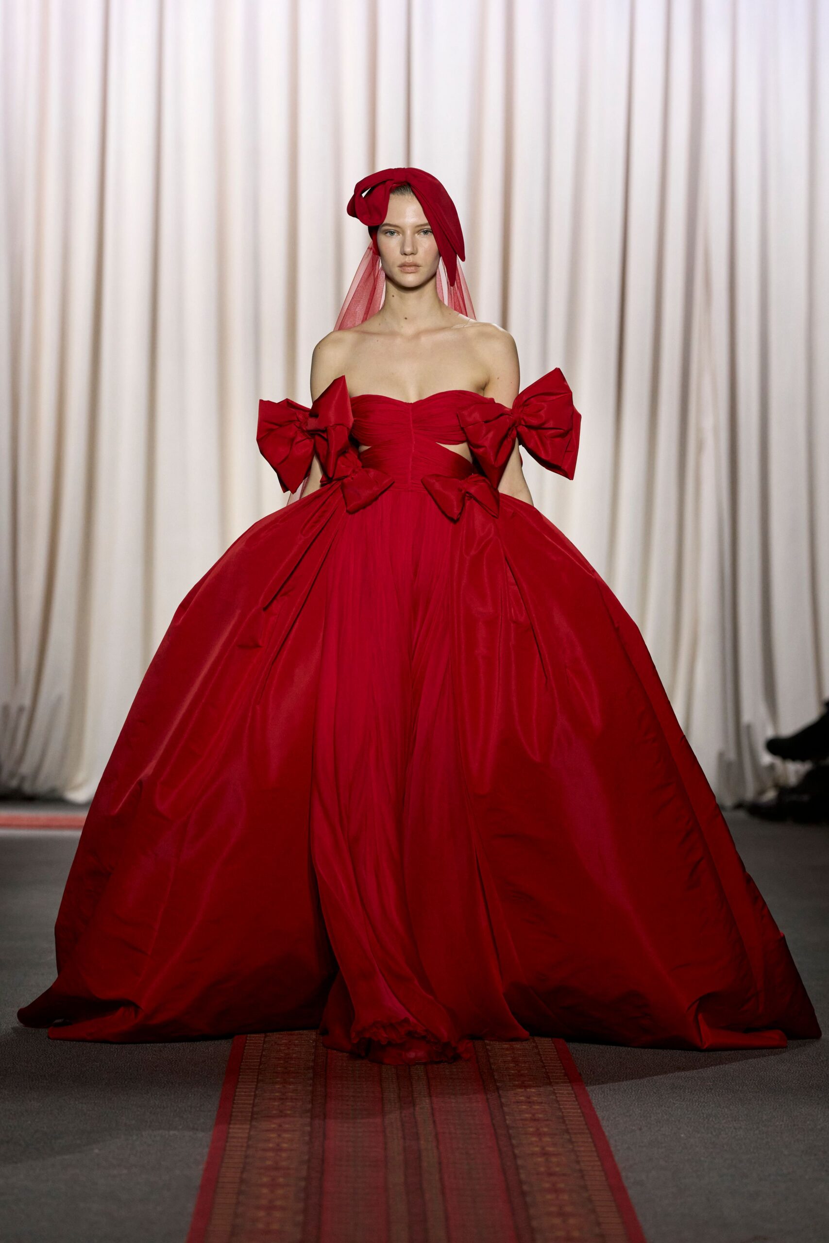 red strapless pleated gown