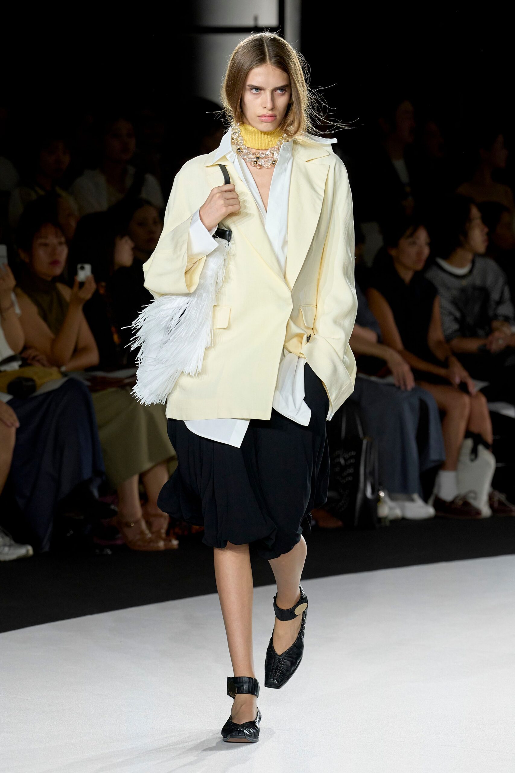 yellow oversized blazer with black skirt
