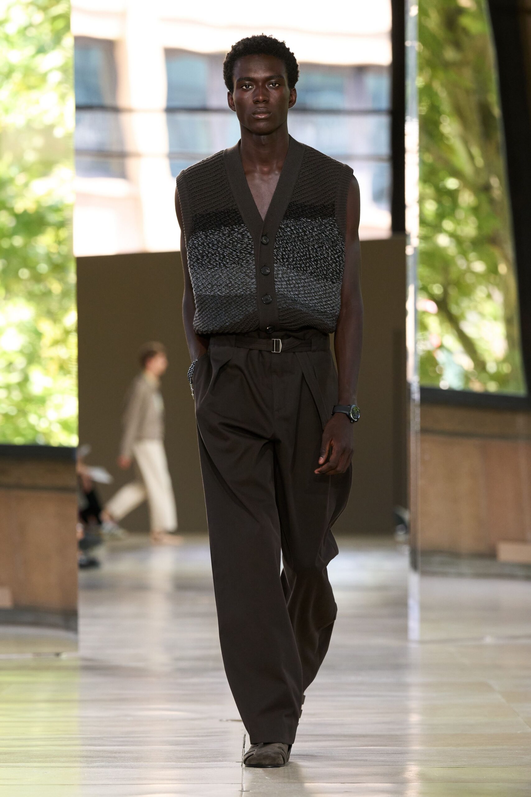 black gray relaxed vest with brown pants