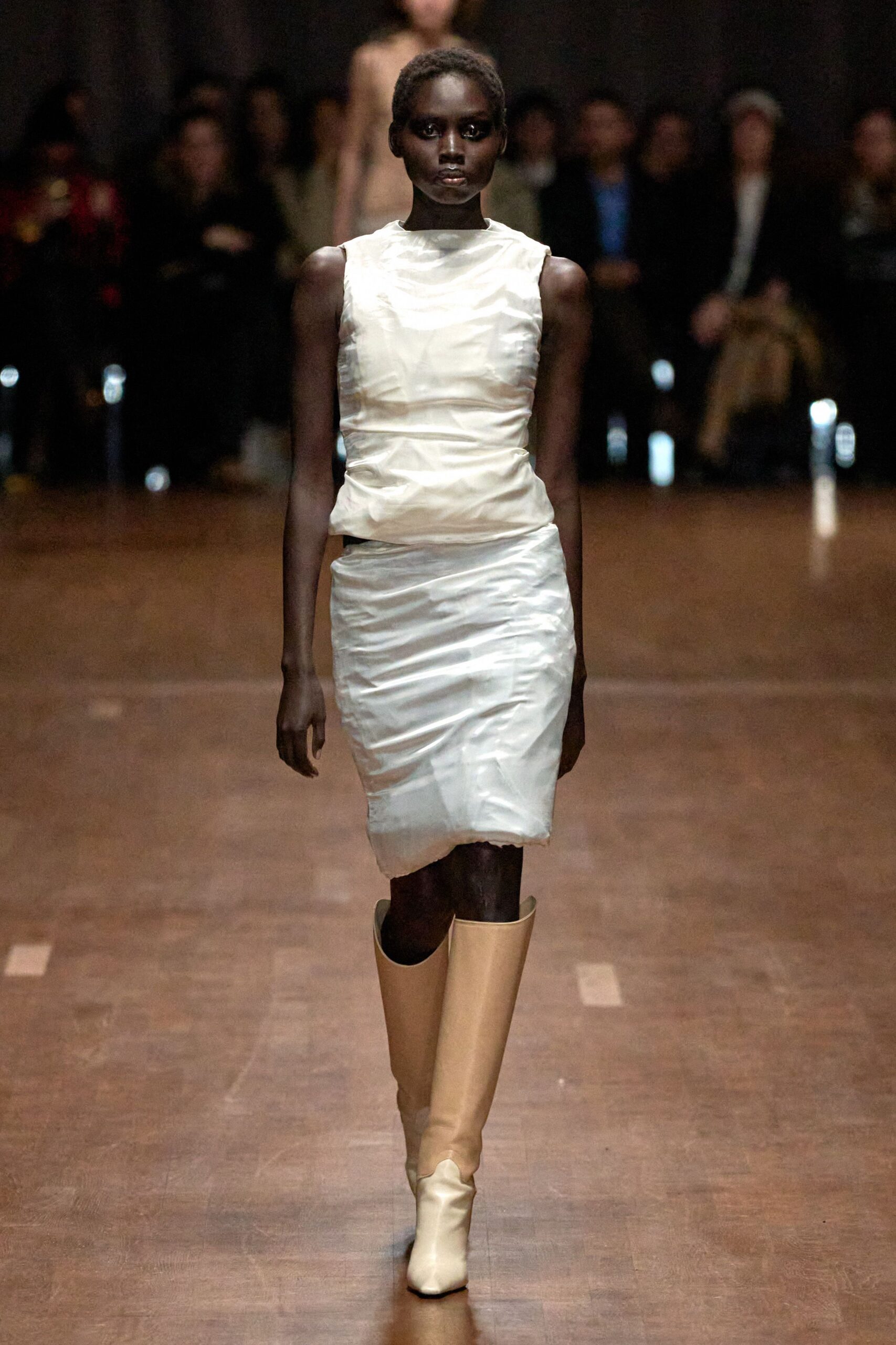 white silk sleeveless dress with beige boots