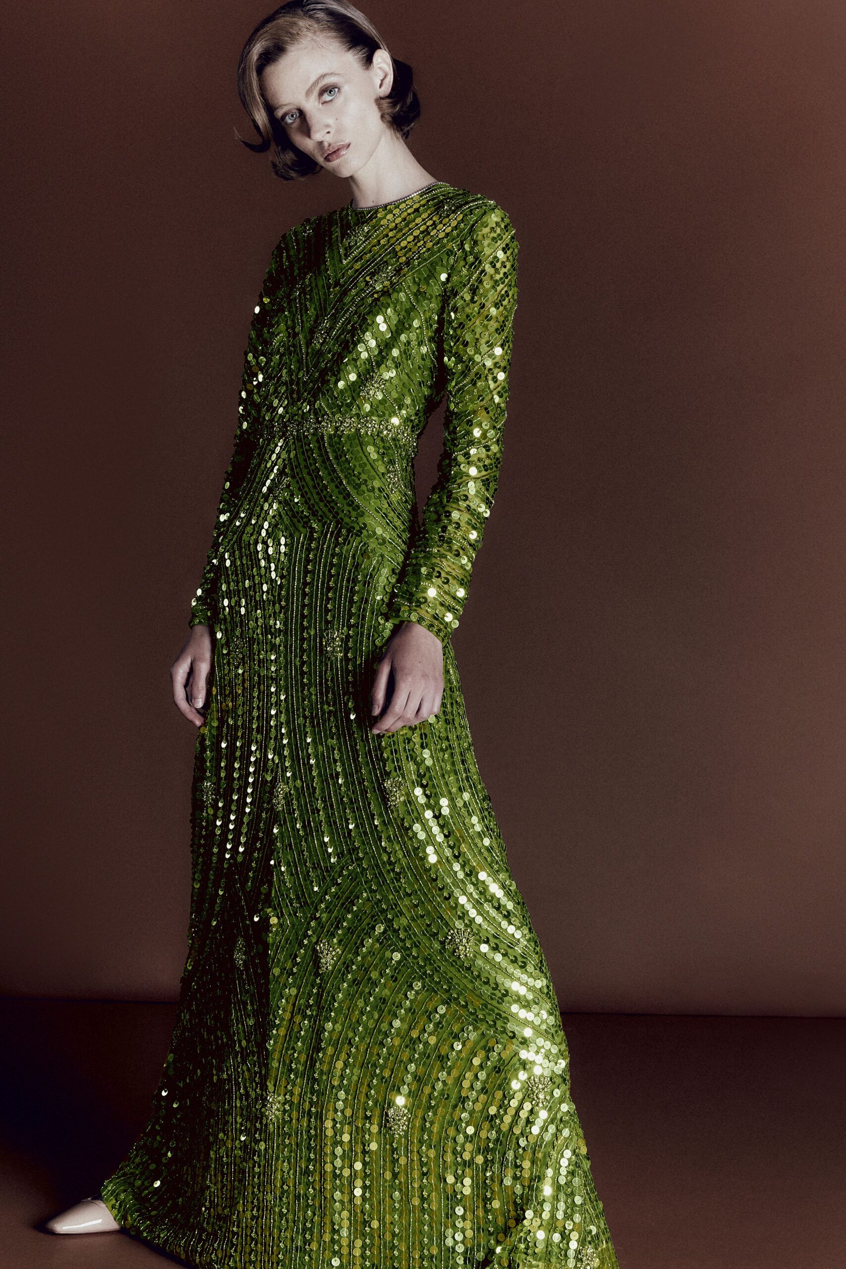 green sequined long-sleeve gown