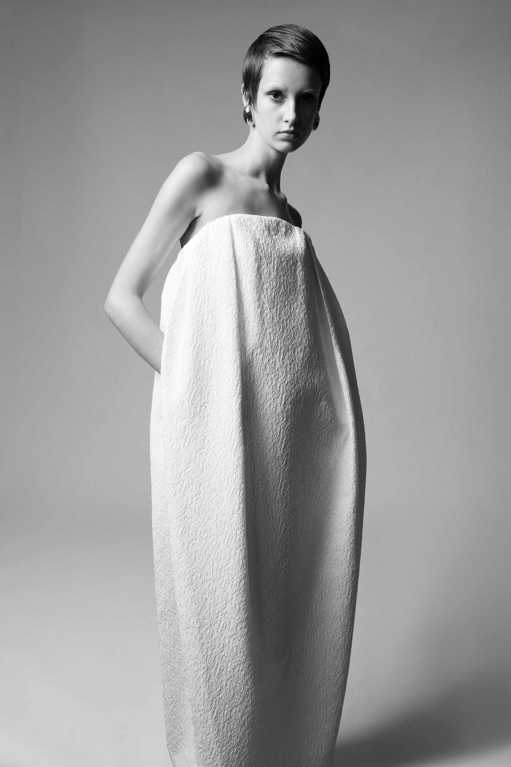 white strapless pleated gown