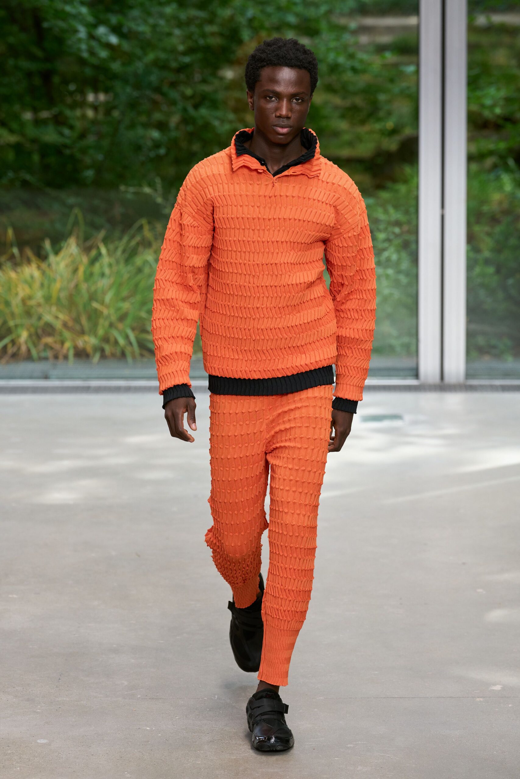 orange textured sweater and pants