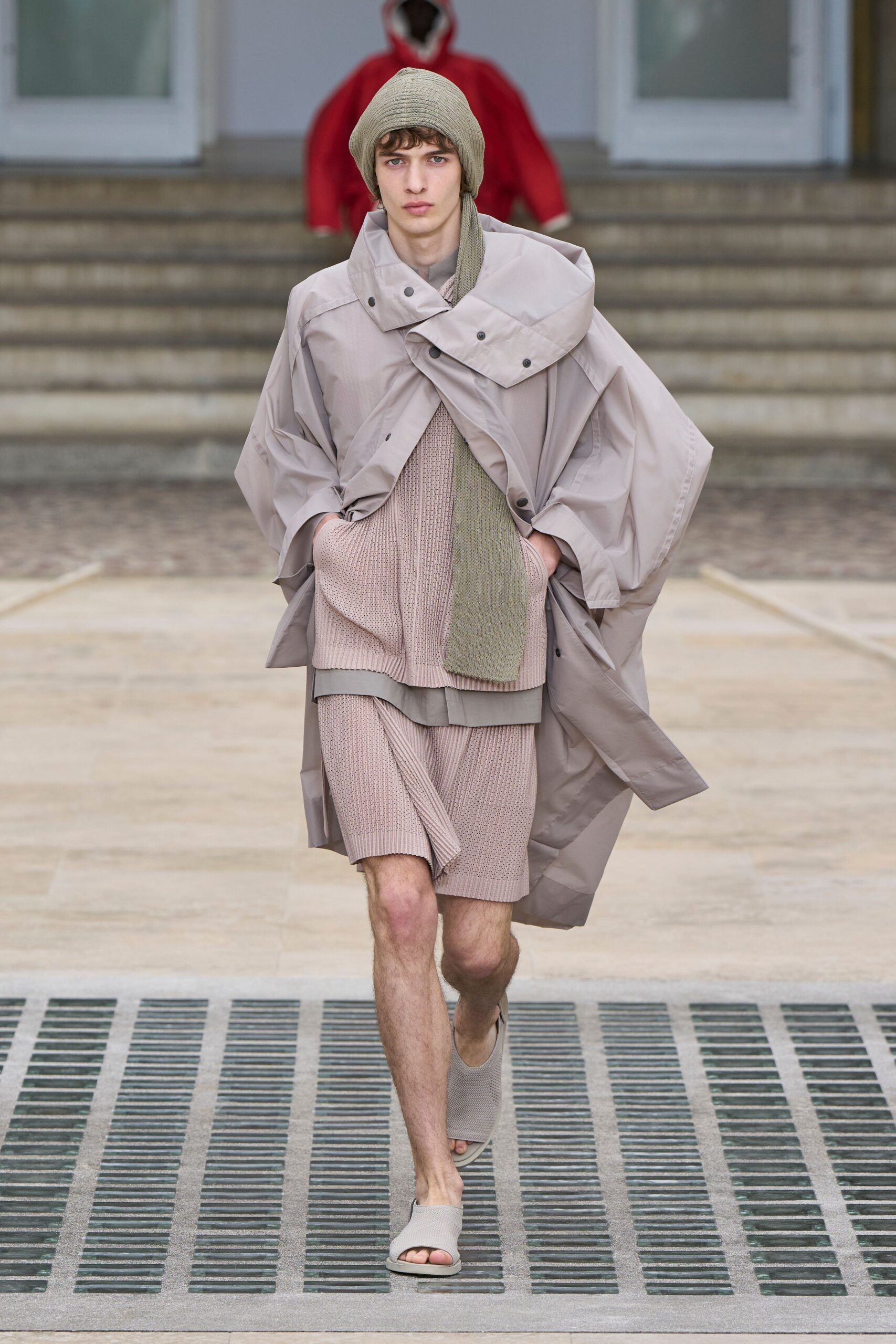 beige coat with pink top and shorts
