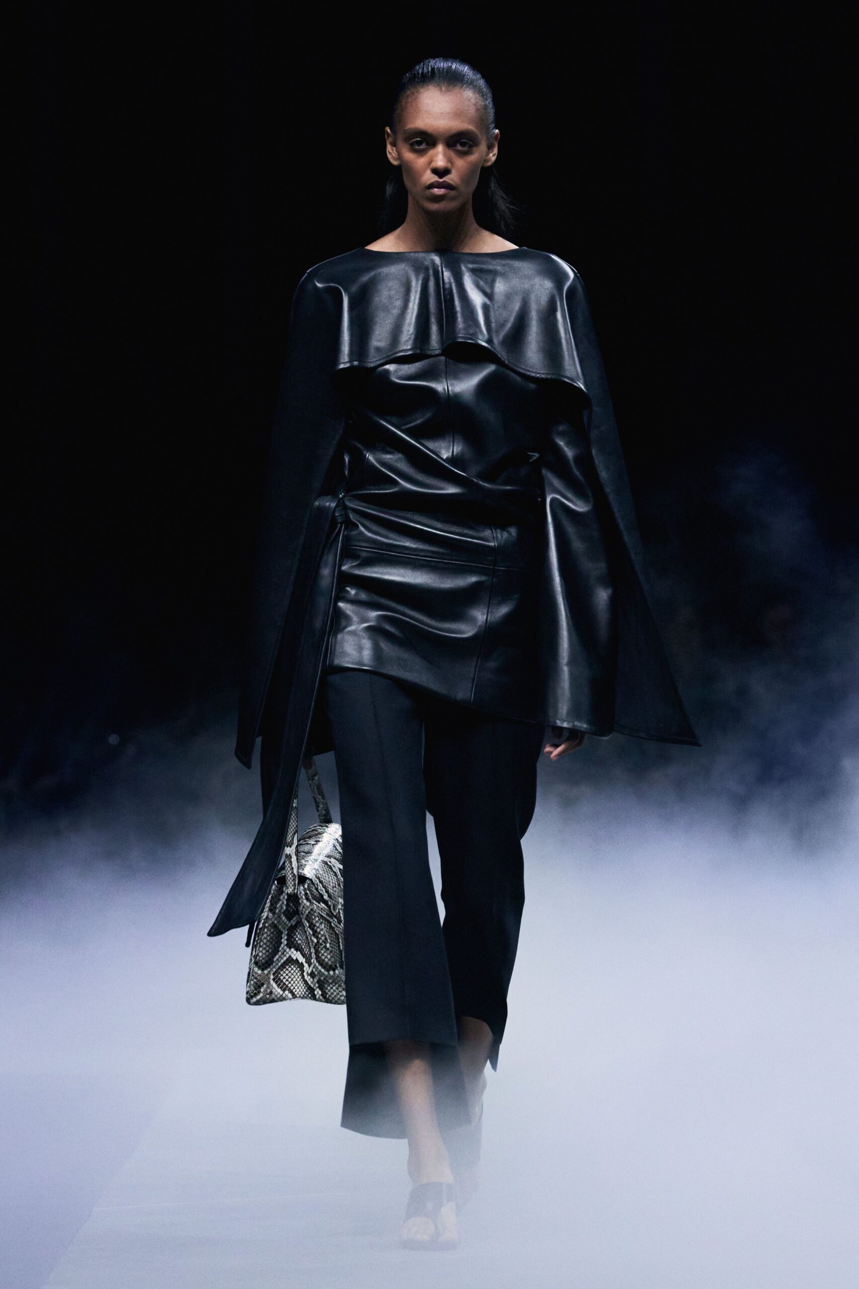 black leather long-sleeve off-shoulder fitted draped top