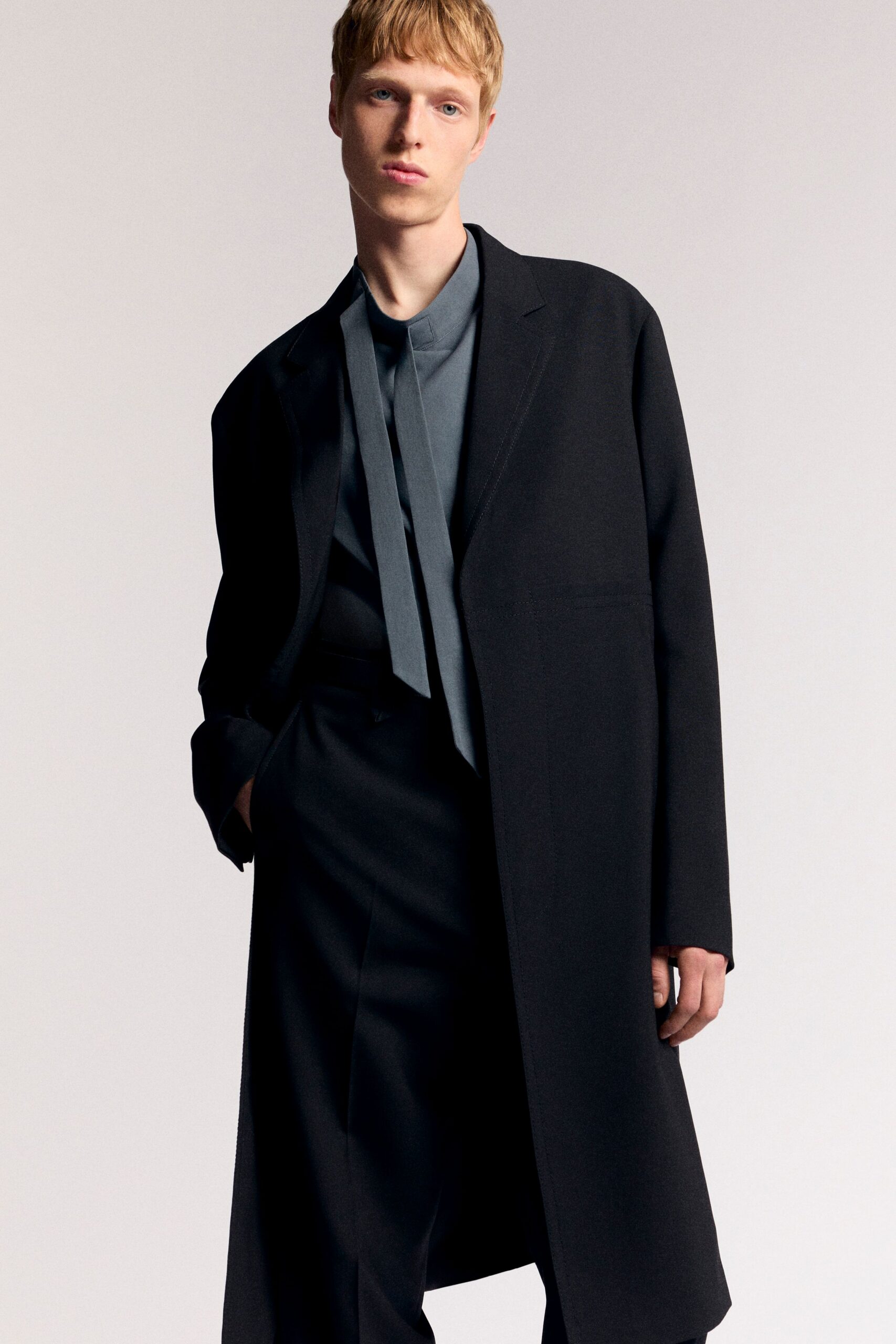 black oversized coat gray shirt tailored pants