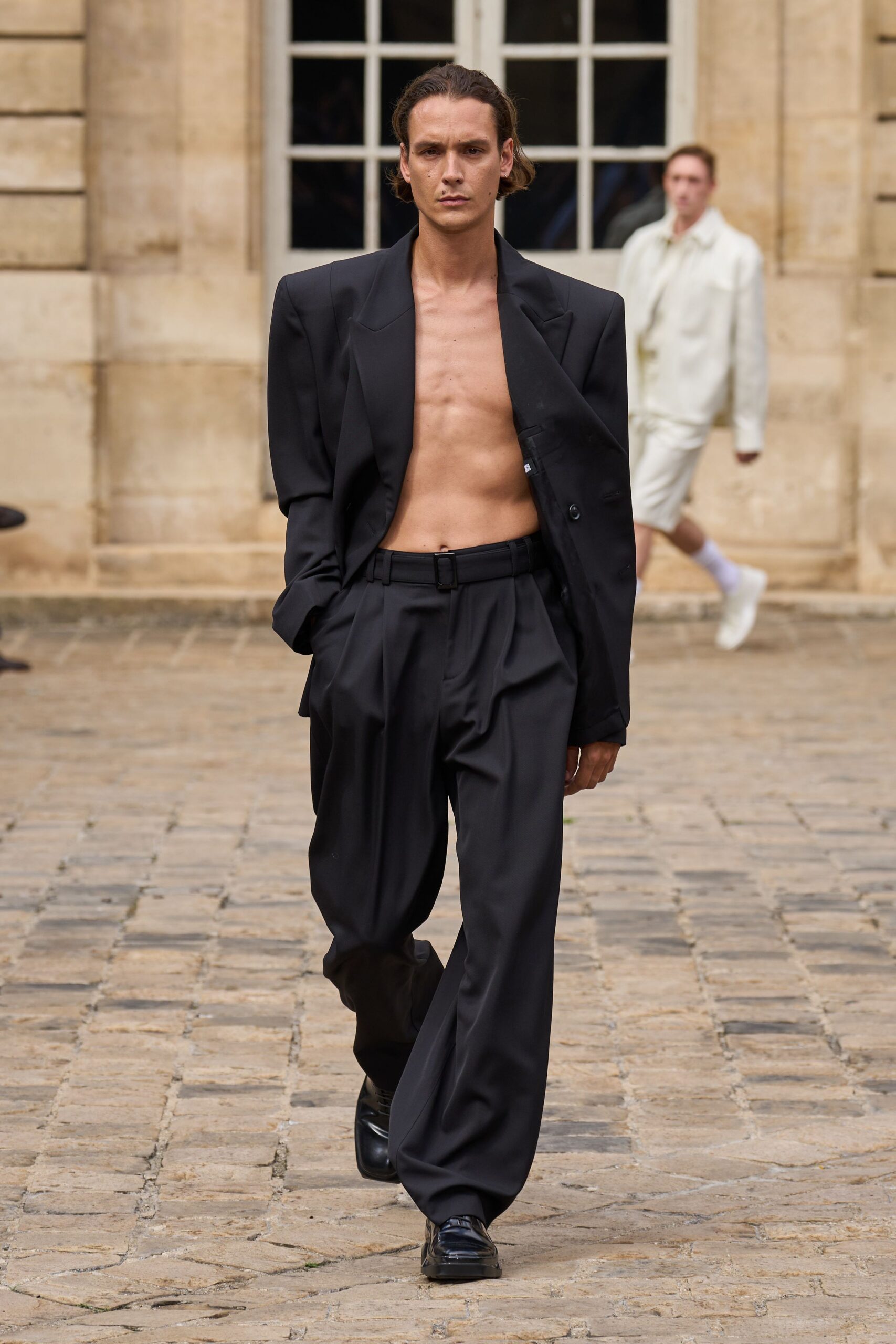 black structured blazer and relaxed pants