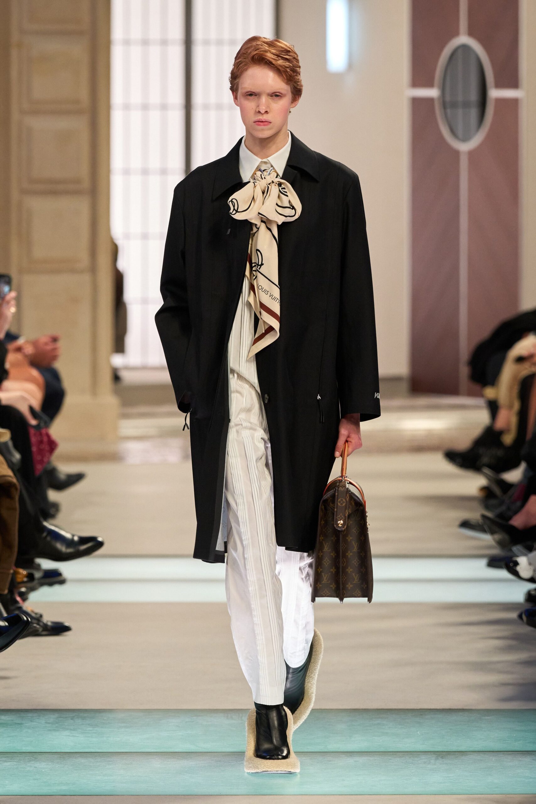 black coat with white shirt and striped pants