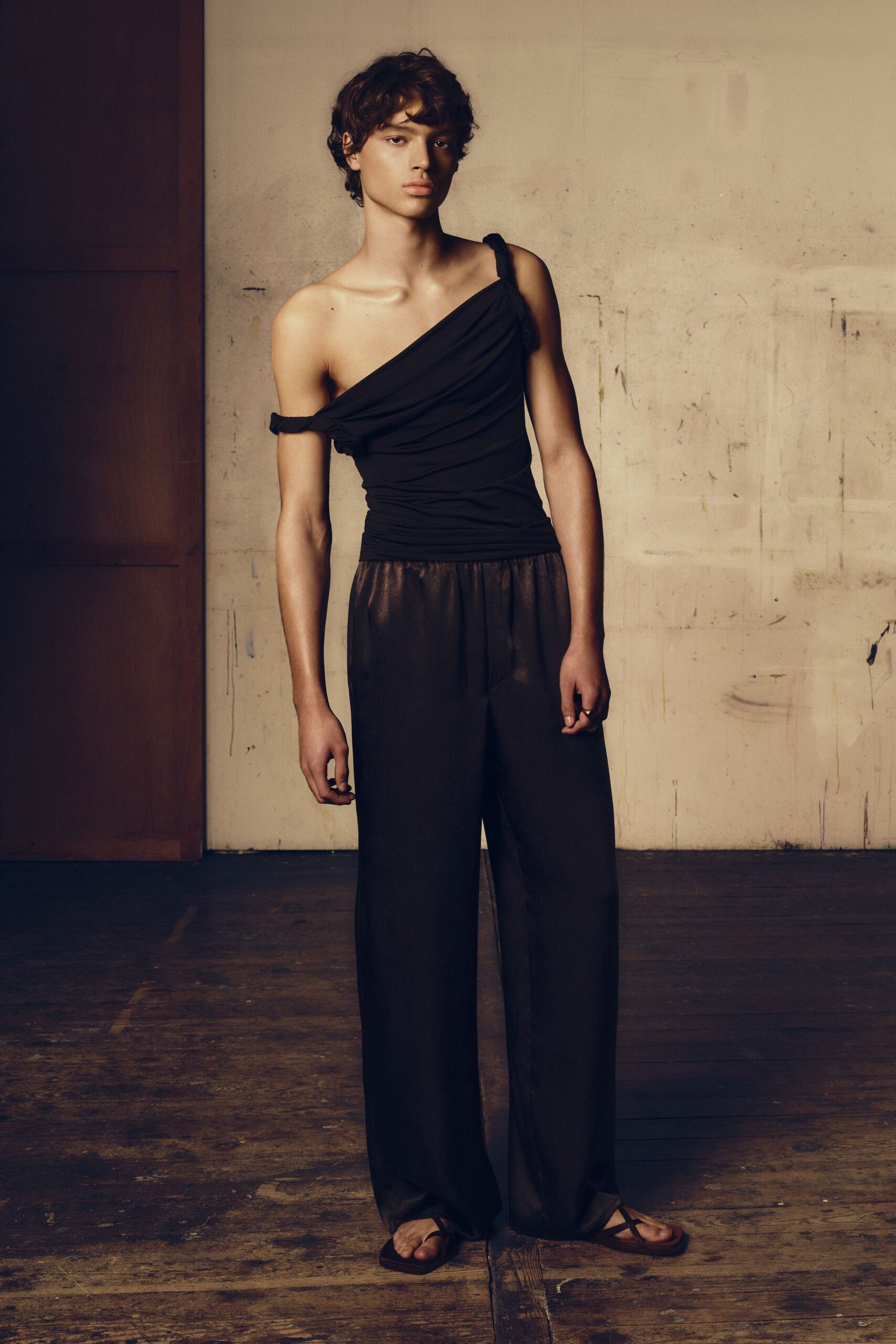black silk off-shoulder top and relaxed pants