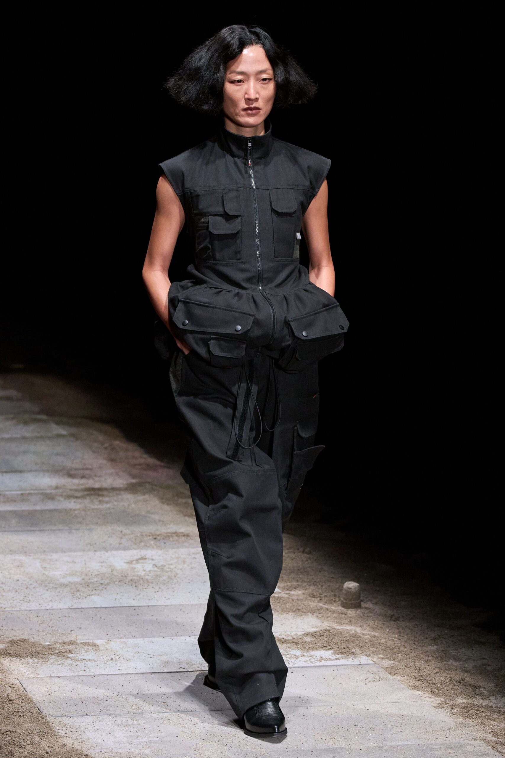 black fitted sleeveless jumpsuit with pockets