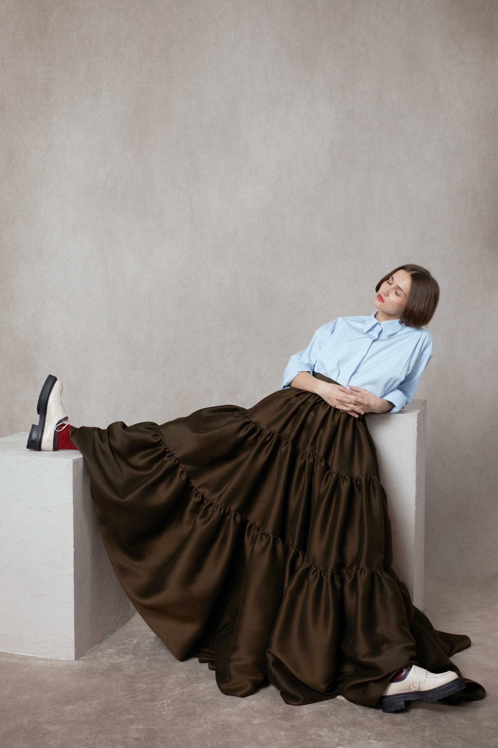 blue shirt brown tiered skirt