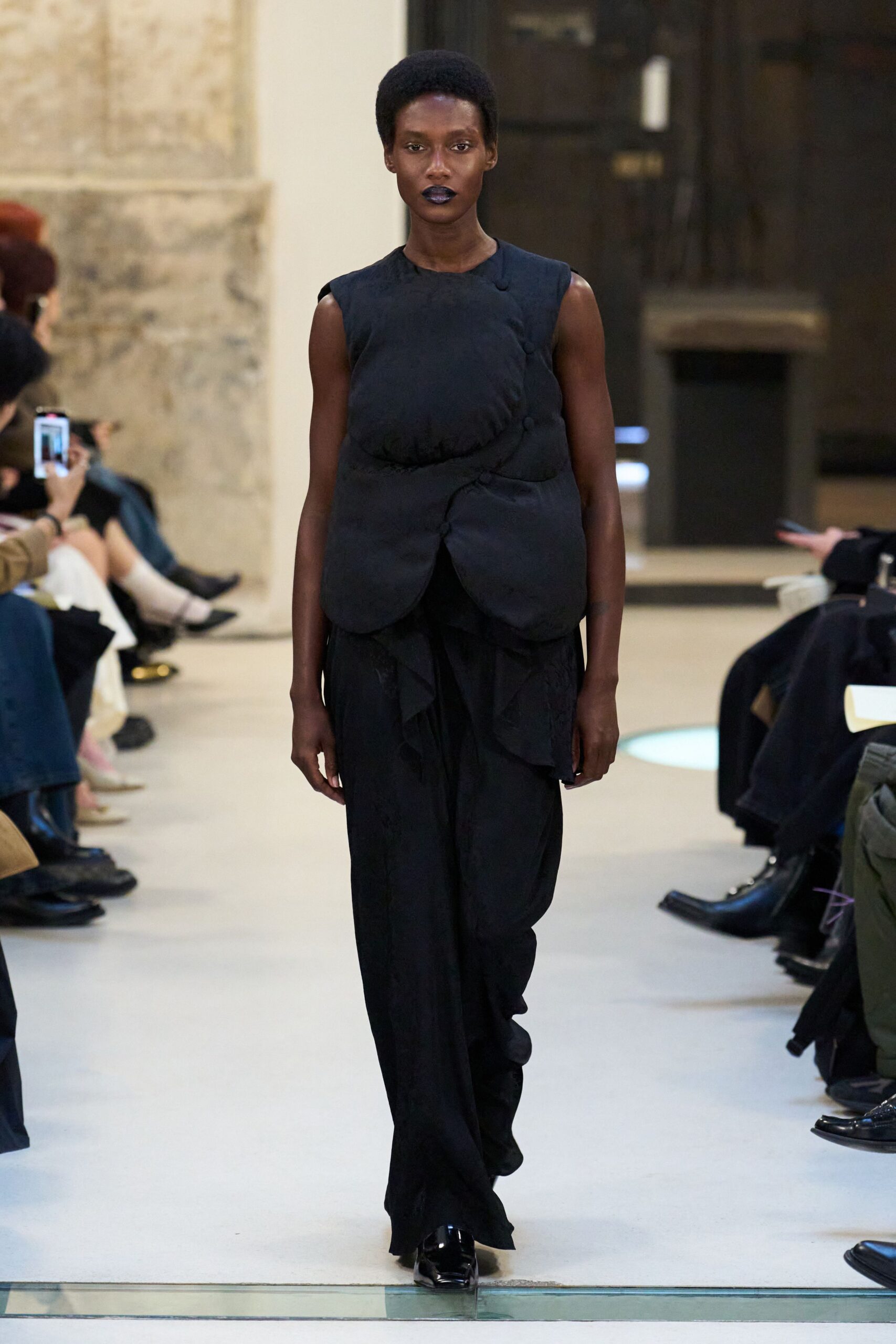 black fitted top and relaxed pants