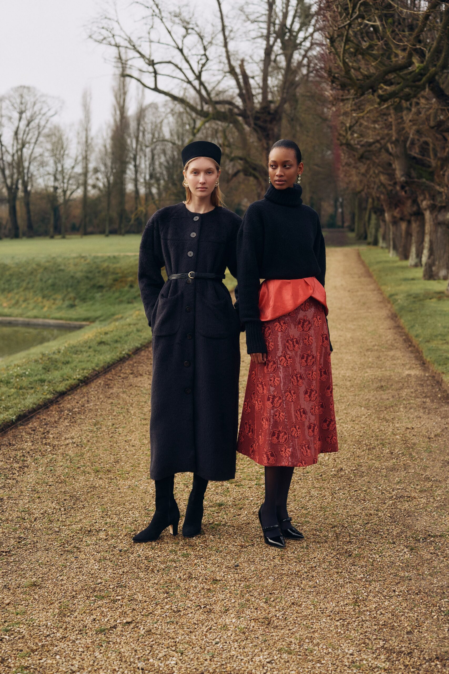 black wool long-sleeve collared fitted buttoned belted coat