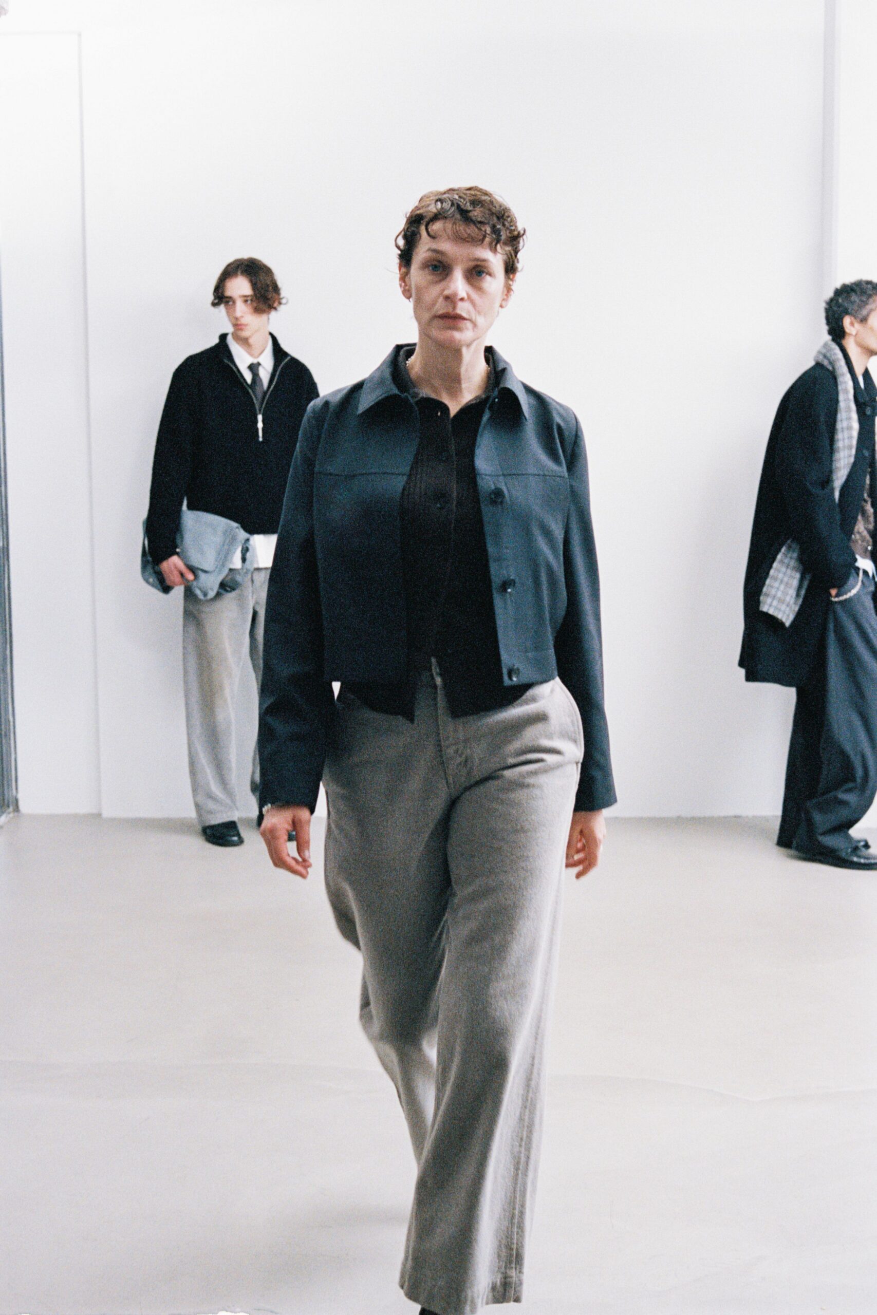 black fitted jacket and gray pants