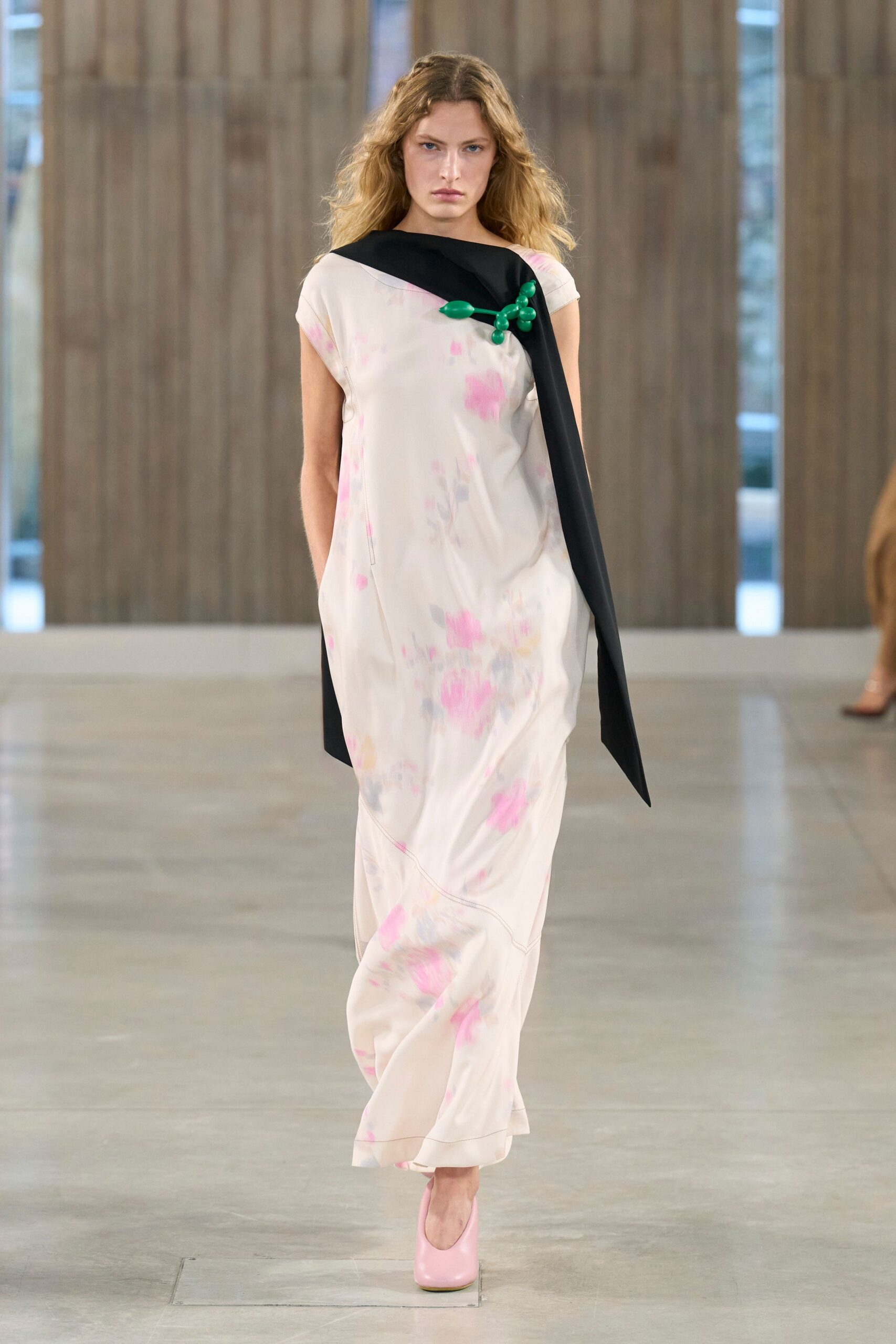 pink floral gown with black cape