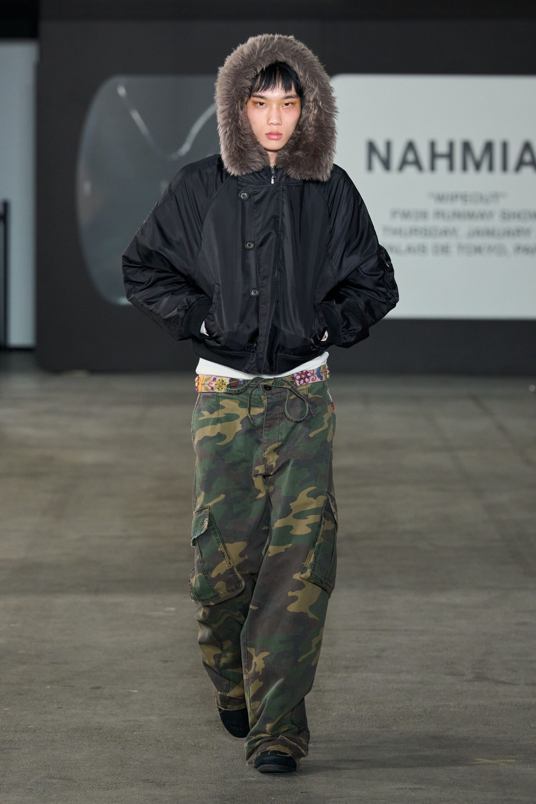 black padded jacket with camouflage pants
