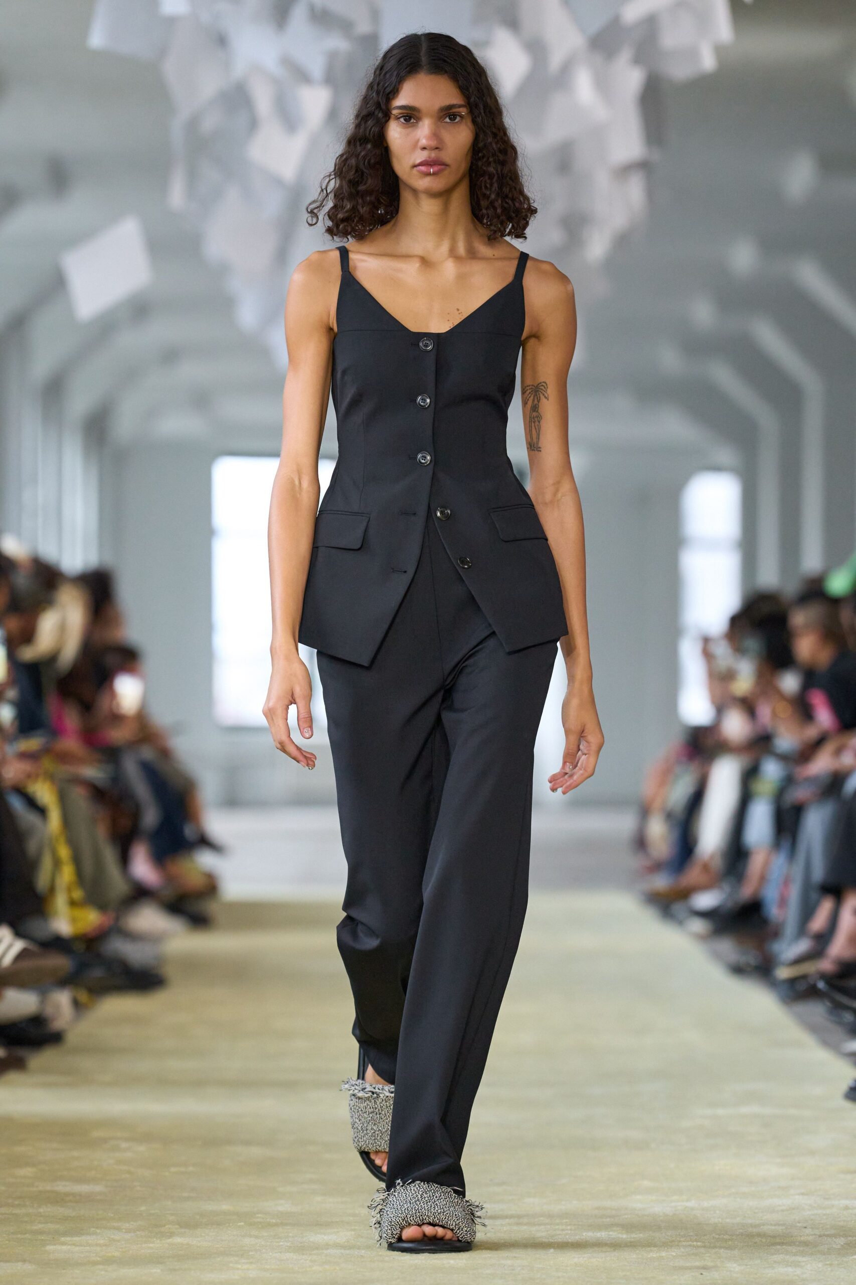 black fitted suit with embellished shoes